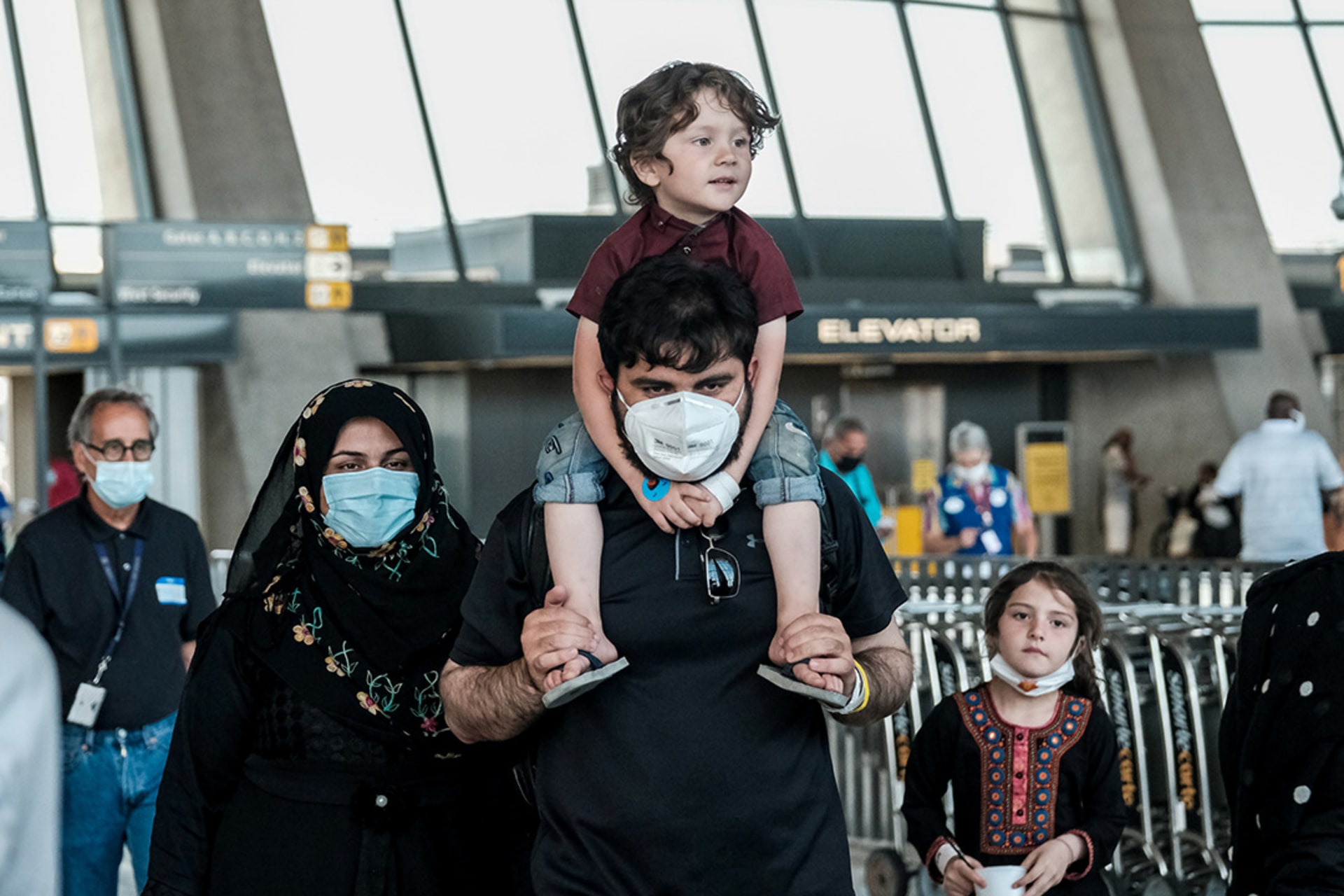 Afghan refugees arrive at Dulles International Airport in Virginia in August 2021. Michael A. McCoy/Reuters