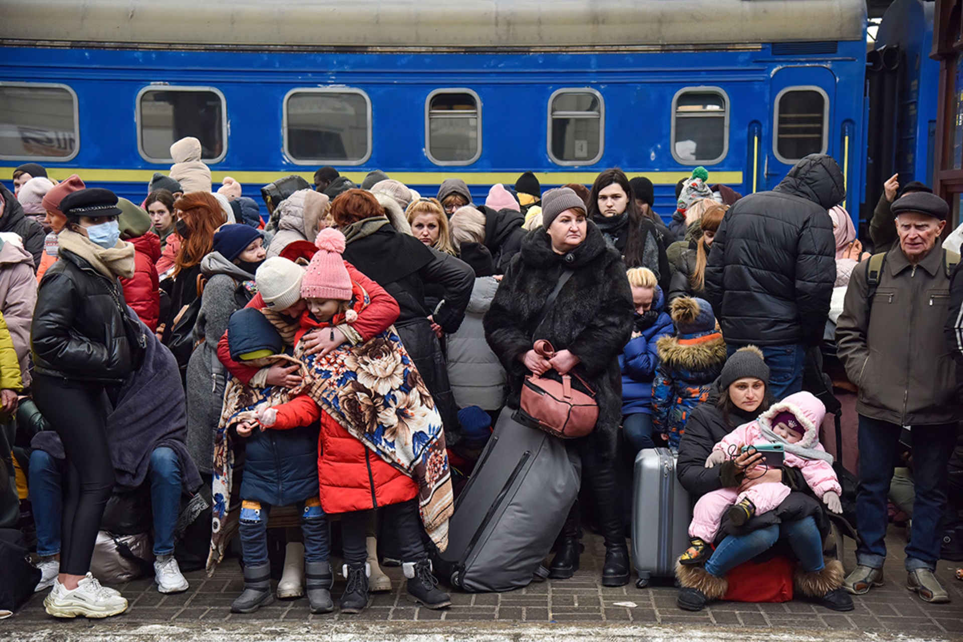 Amid the Russian invasion, refugees wait at a railway station in Lviv, Ukraine, for a train to Poland. Pavlo Palamarchuk/SOPA Images/LightRocket/Getty Images