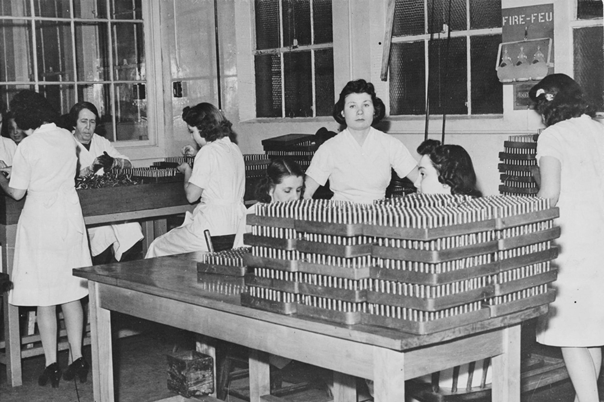 Women handle racks of cartridge cases at a Canadian factory, where bullets for machine guns are fashioned into shape for the Allied war effort. Hulton Archive/Getty Images