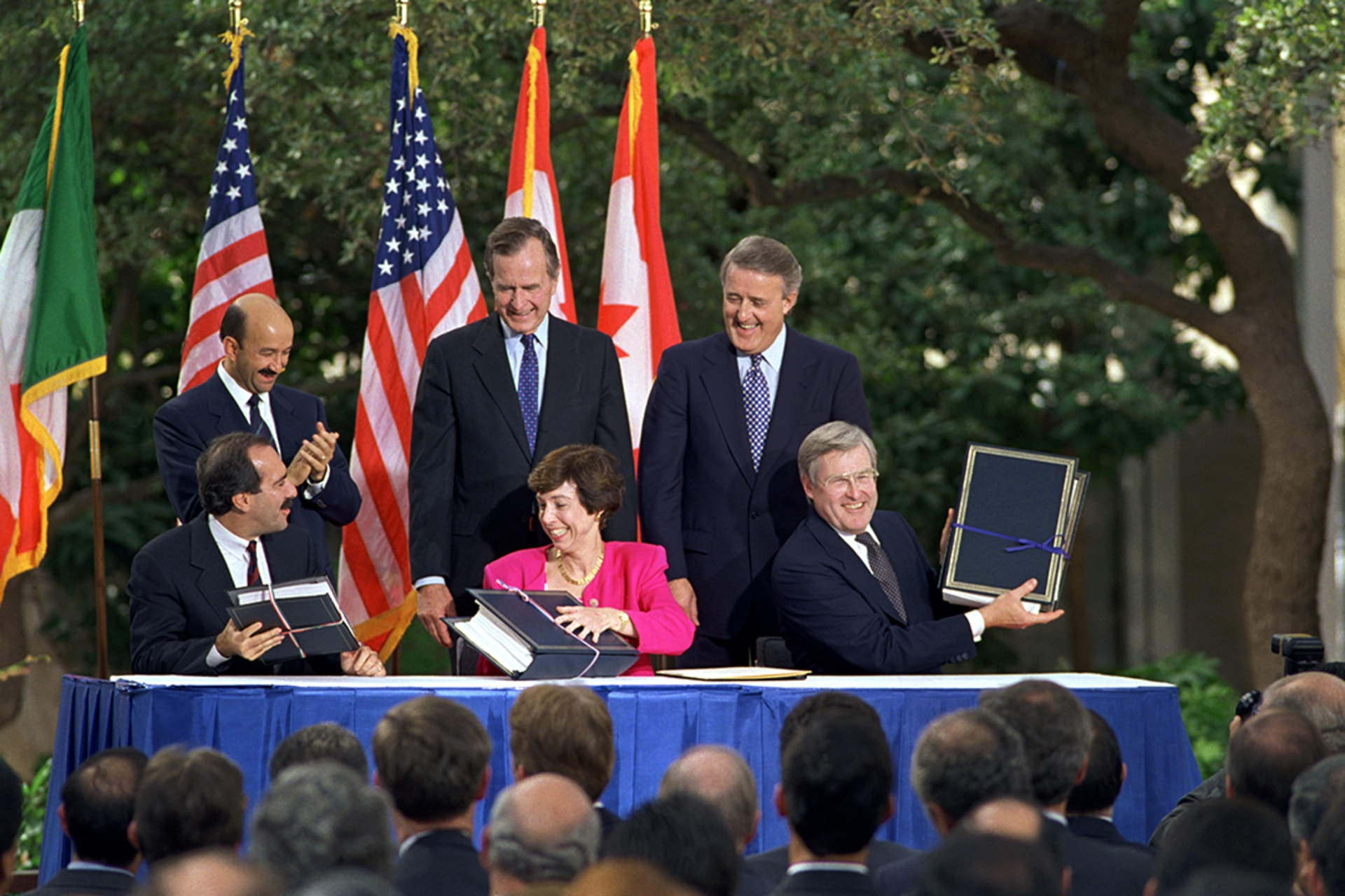 The leaders of the United States, Canada, and Mexico, as well as each country’s chief trade representative, attend the initializing ceremony for the North American Free Trade Agreement in San Antonio, Texas. Bettmann/Getty Images