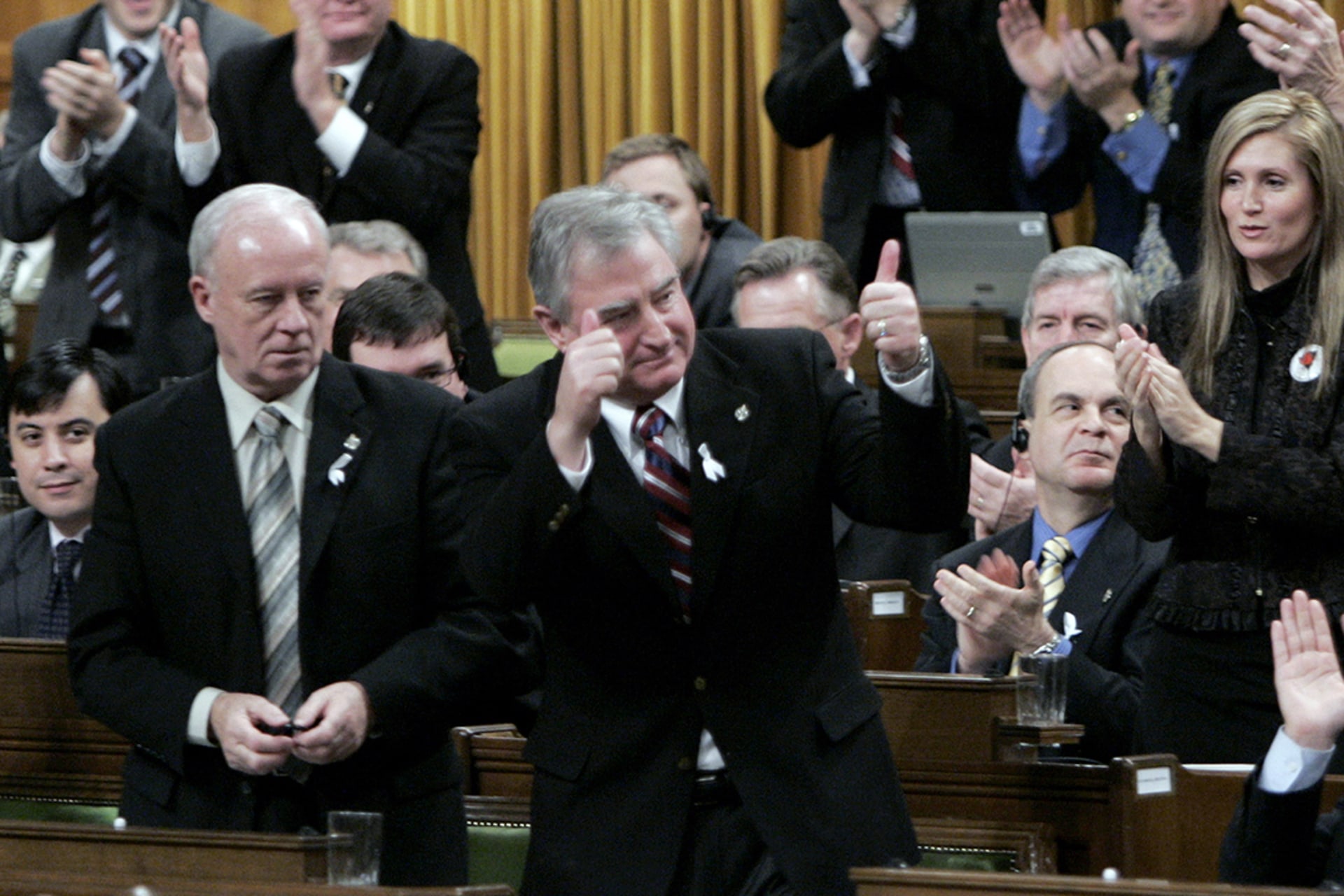 Canadian International Trade Minister David Emerson stands to vote in favor of the 2006 softwood lumber agreement with the United States. Chris Wattie/Reuters