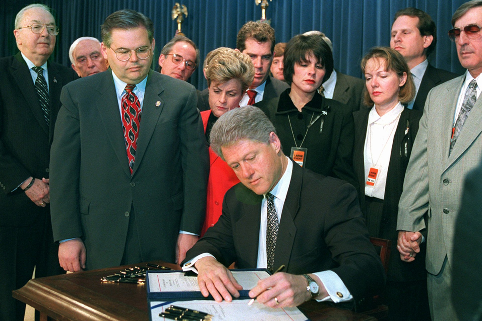 President Bill Clinton signs the Helms-Burton bill.