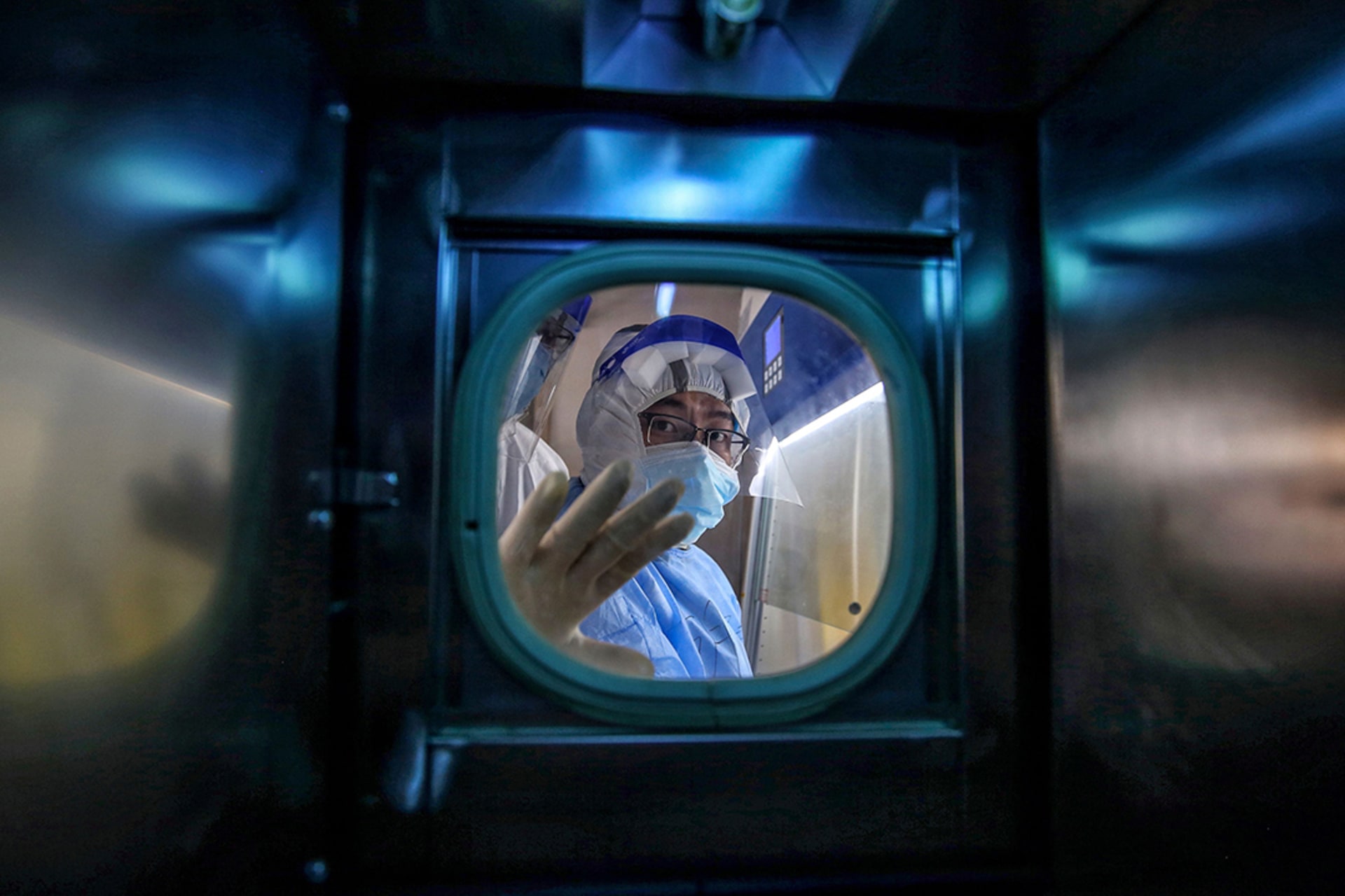 A medical worker stands inside an isolation ward at a hospital in Wuhan, China, in March 2020. AFP/Getty Images