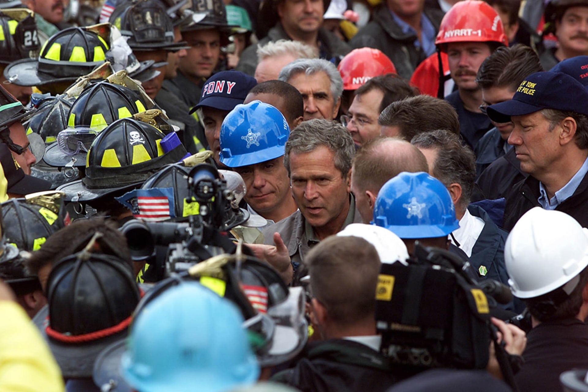 President George W. Bush speaks with firefighters and rescue personnel at New York’s ground zero on September 14. Paul Richards/AFP/Getty Images