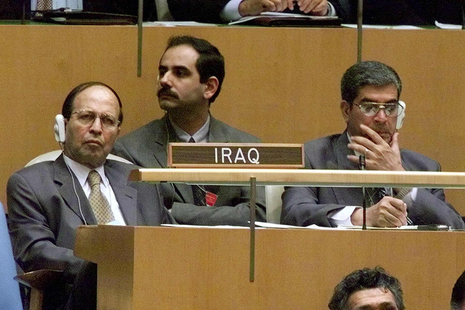 Members of the Iraqi delegation to the UN listen to President Bush’s address to the General Assembly in September 2002, pressing for swift action against Iraq despite objections by many U.S. allies. Jim Bourg/Reuters