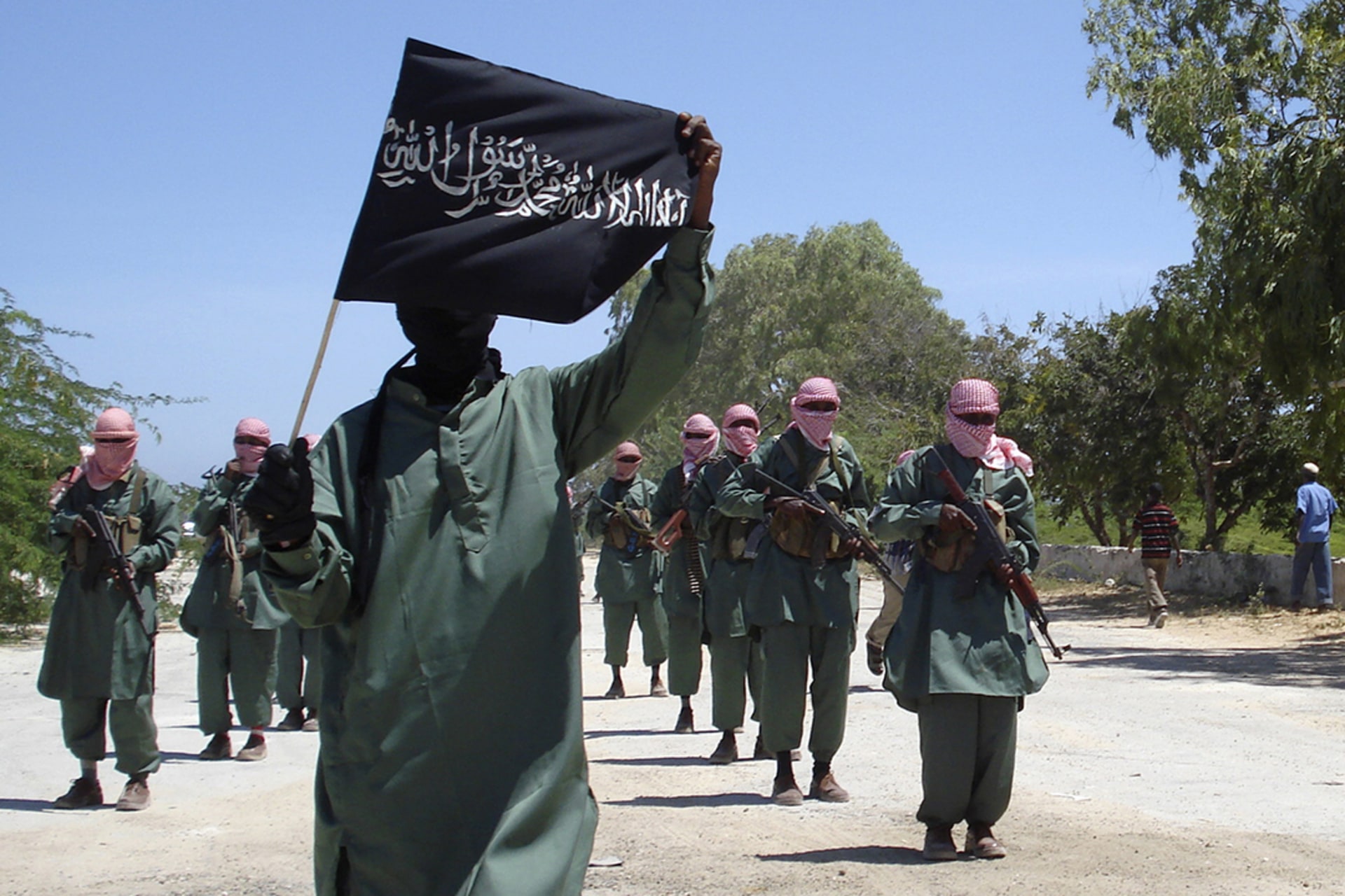 Al-Shabaab fighters march on the outskirts of Mogadishu. Mowliid Ibdi/Reuters