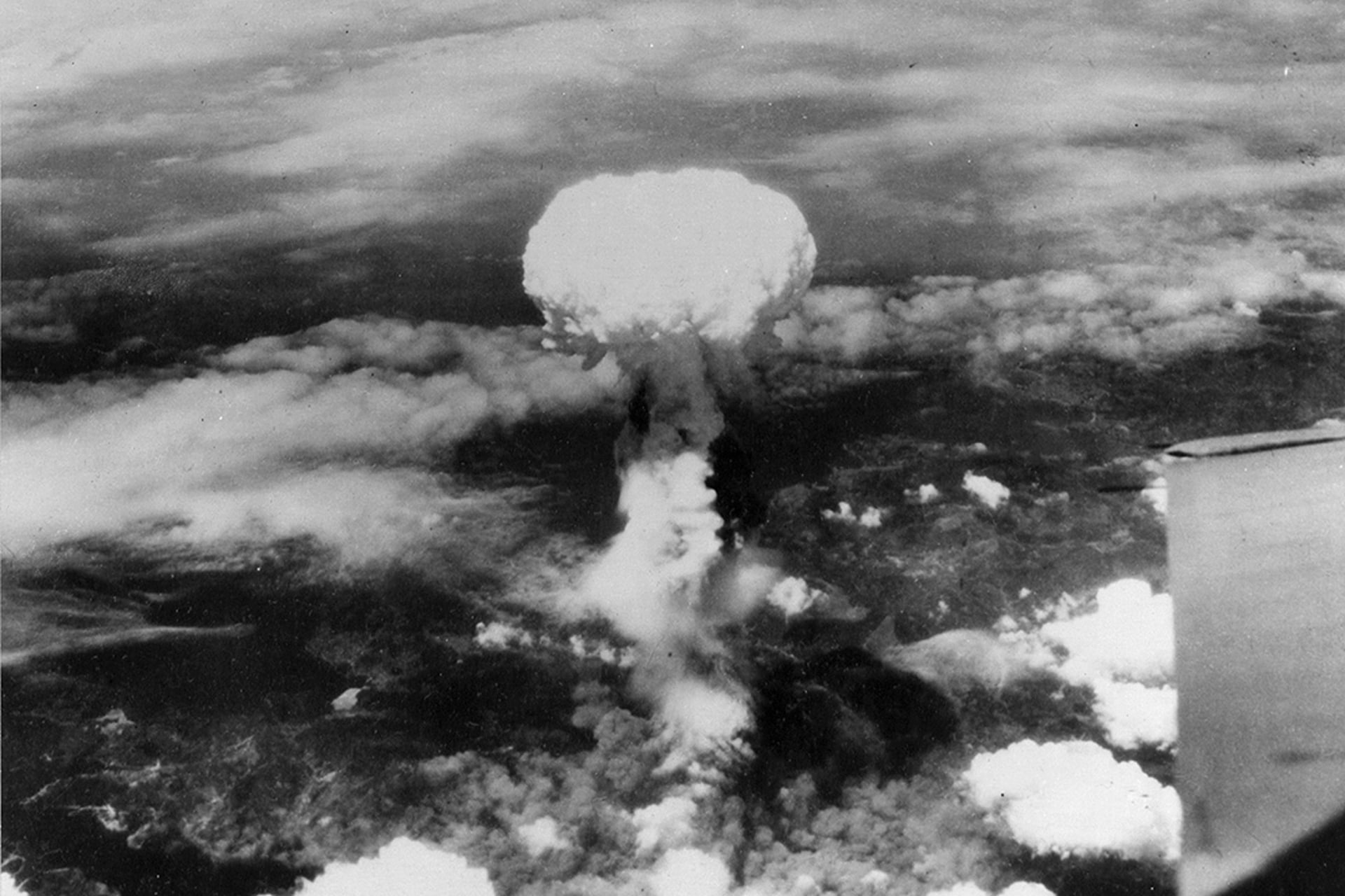 Smoke billows up over Nagasaki, Japan, after the United States drops an atomic bomb on August 9.