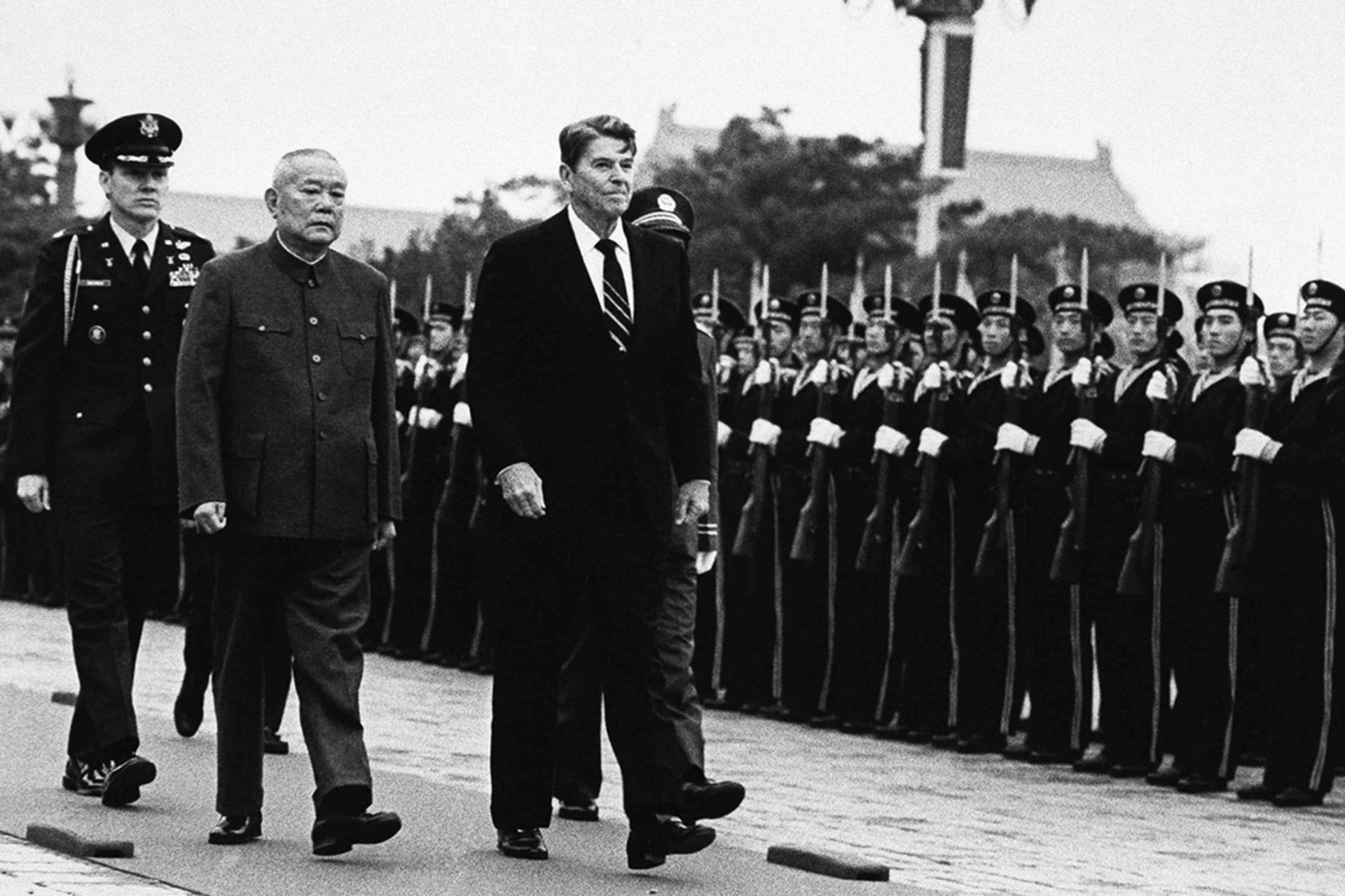 U.S. President Ronald Reagan and Chinese President Li Xiannian review a military honor guard in Beijing. 

