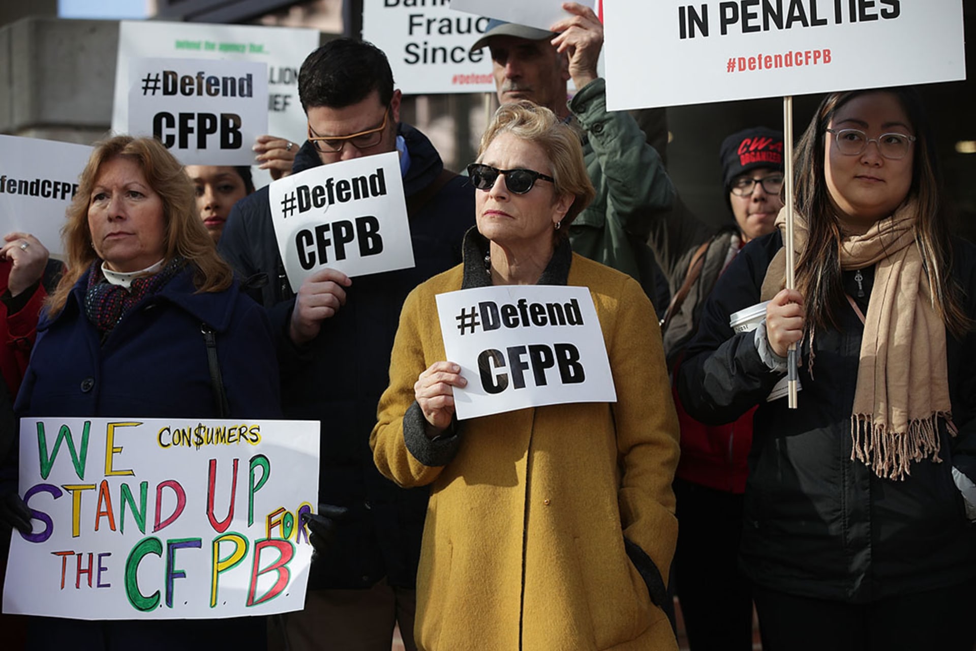 Supporters of the Consumer Financial Protection Bureau protest Mulvaney’s appointment in November 2017.