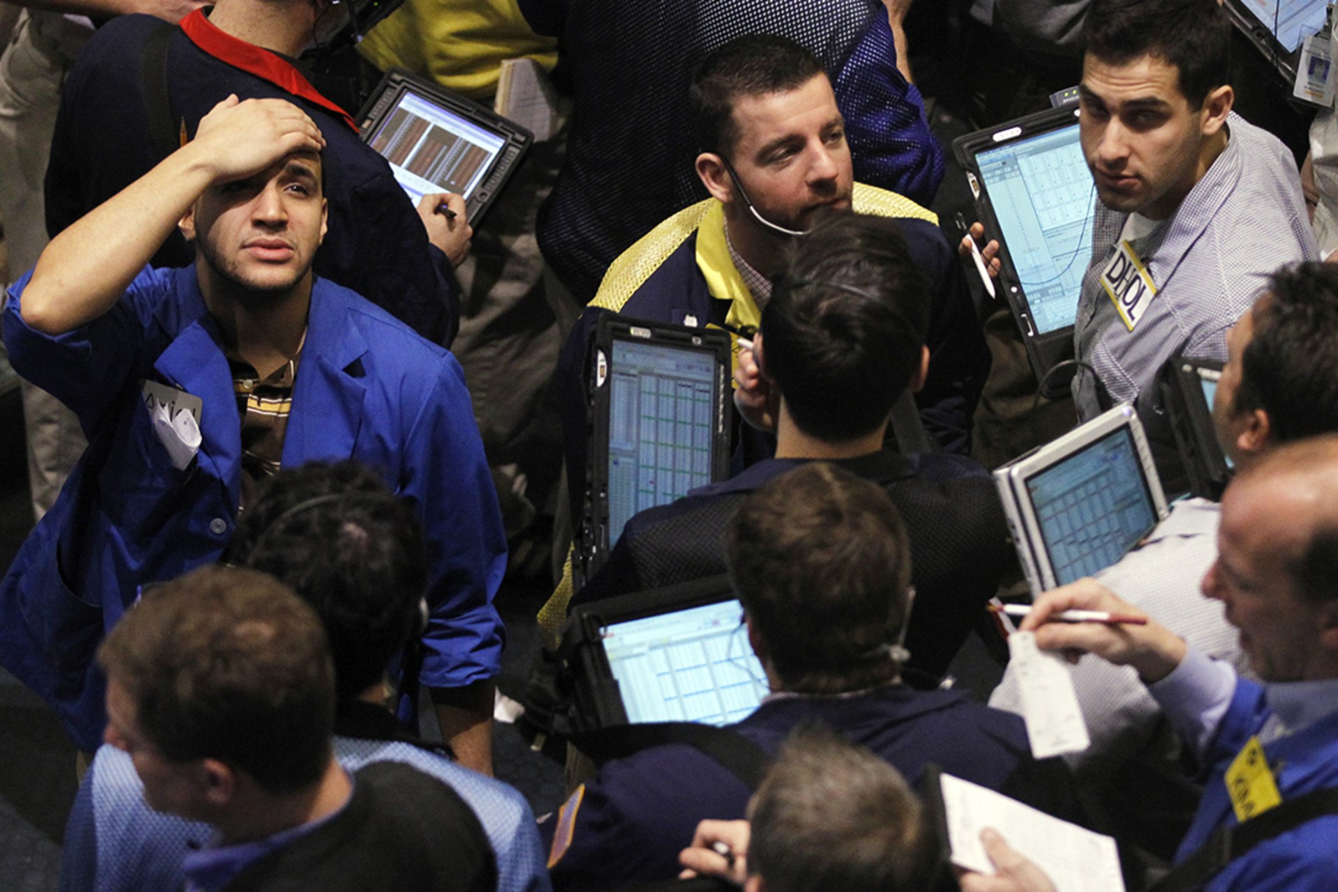 Traders work in the oil options pit on the floor of the New York Mercantile Exchange in New York City, February 22, 2011.