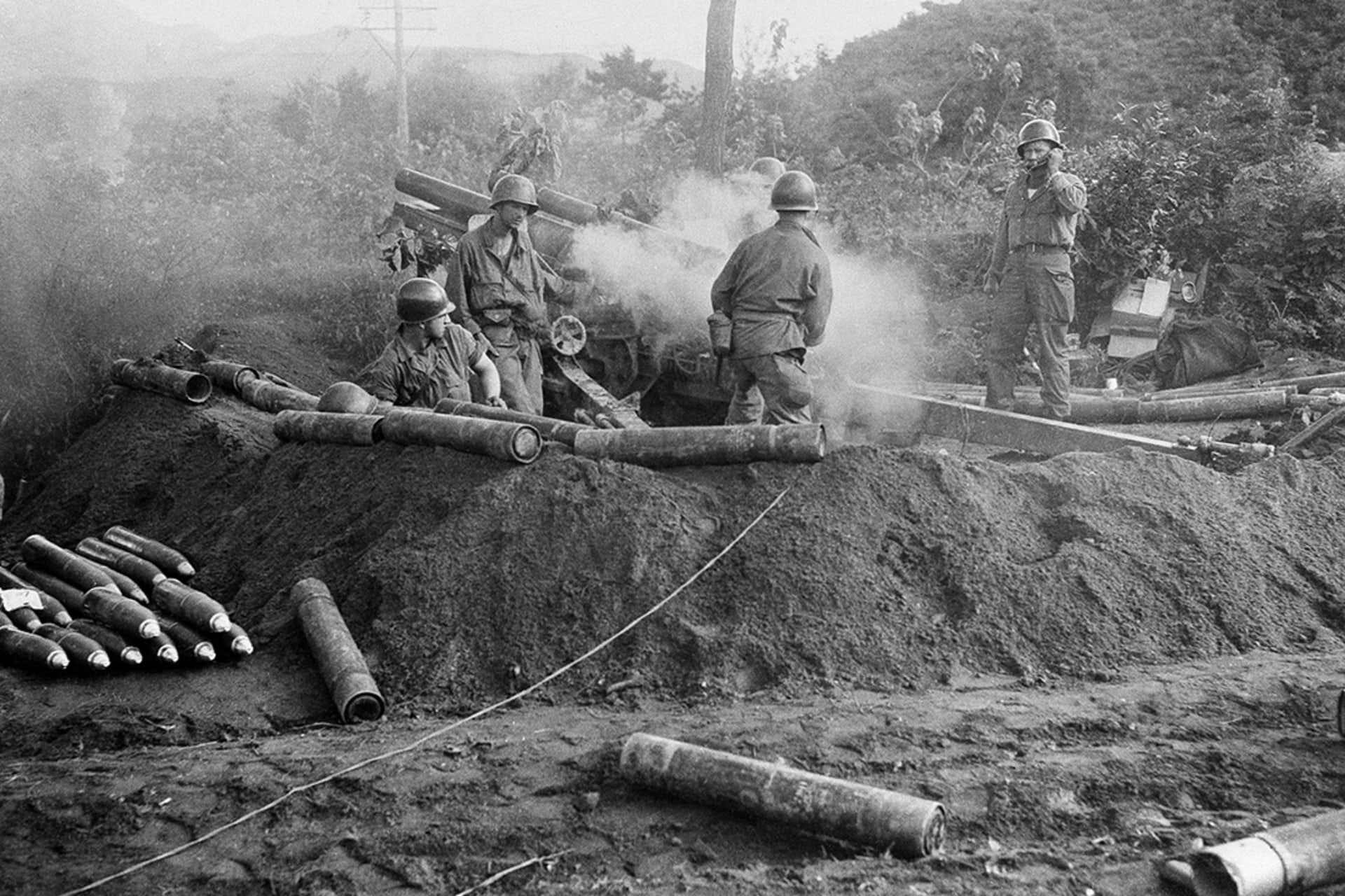 U.S. soldiers attack North Korean targets during the first weeks of the Korean War. 
