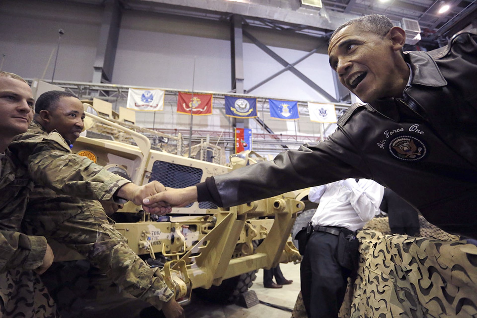 U.S. President Barack Obama shakes hands with troops after delivering remarks at Bagram Air Base in Kabul. 
