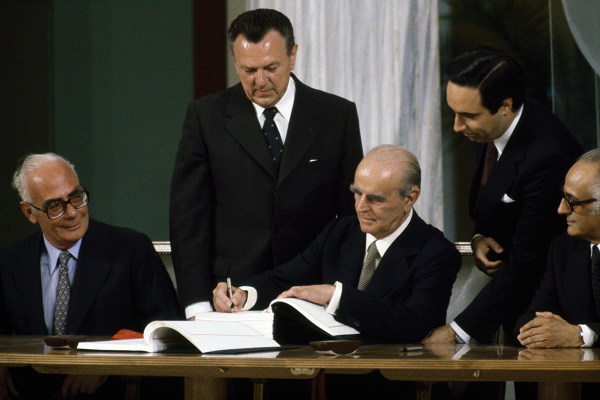 Greek Prime Minister Constantine Karamanlis affirms Greece's full membership of the European Economic Community at a signing ceremony in Athens.