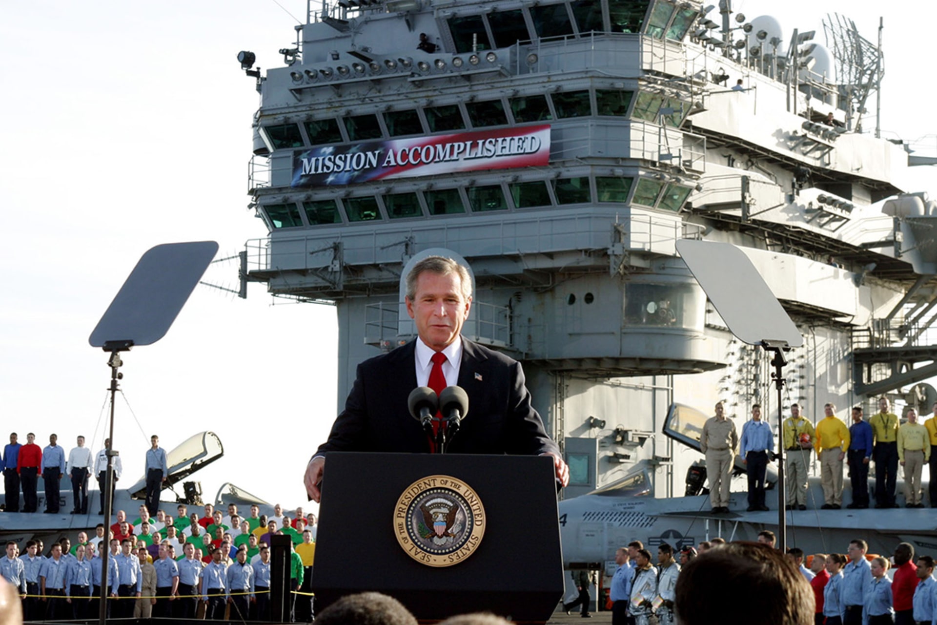 U.S. President George W. Bush declares the end of major combat in Iraq from the deck of the USS Abraham Lincoln off the California coast.
