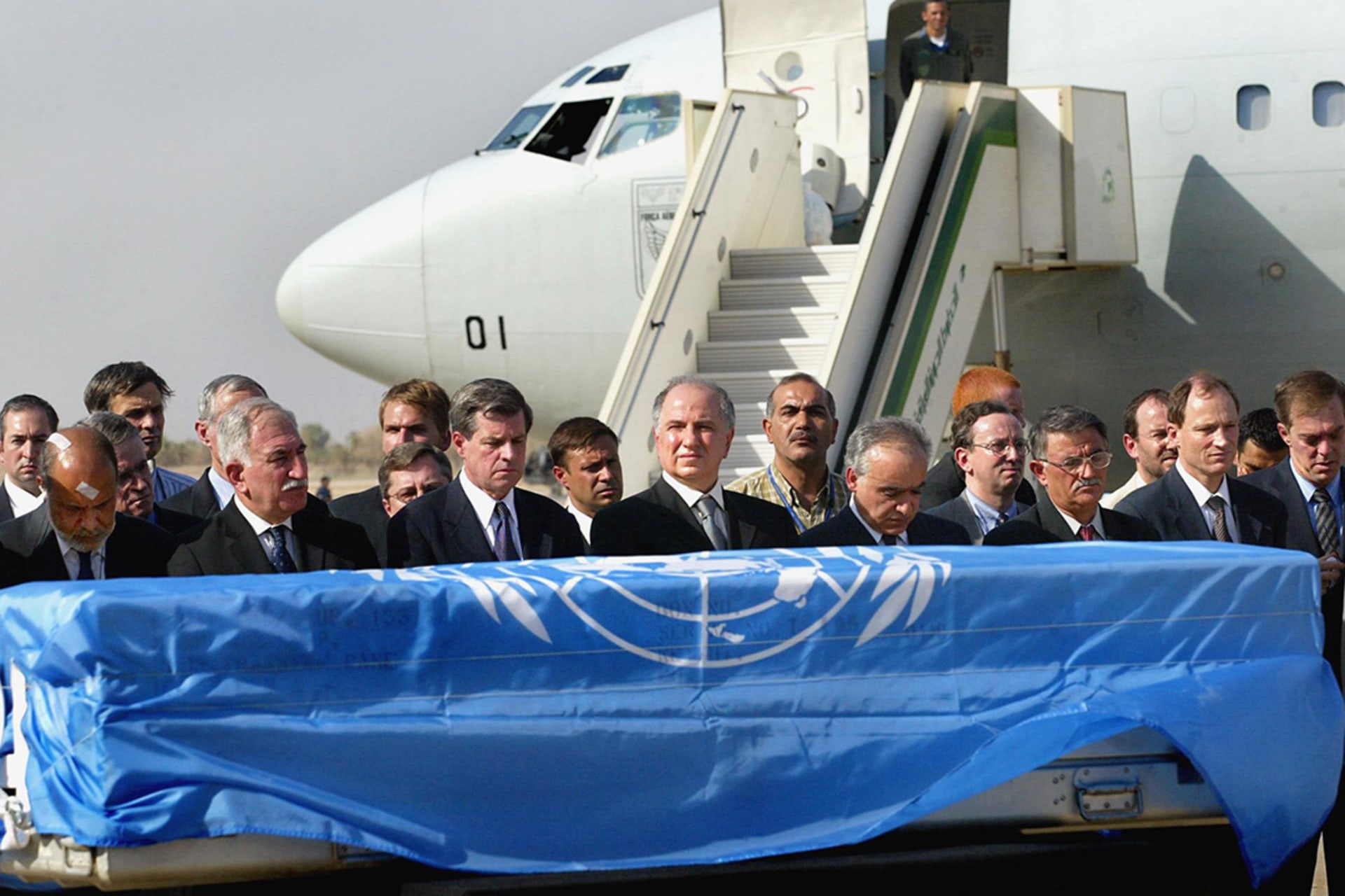 U.S. and UN officials pay respects before the casket of slain UN envoy to Iraq Sérgio Vieira de Mello. 
