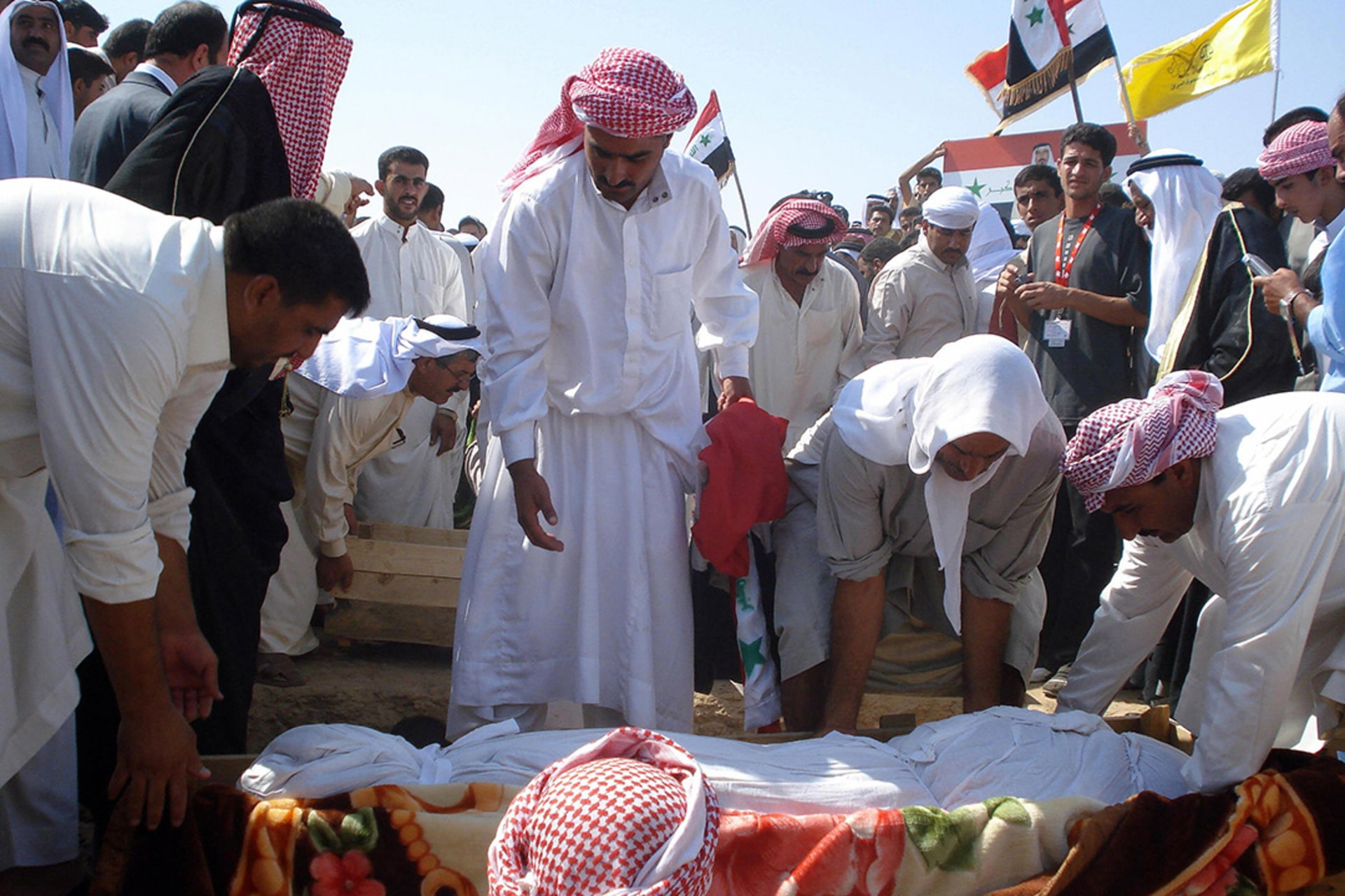 Sunni tribesmen bury their leader, Sheikh Abdul Sattar Abu Risha, and three of his bodyguards in the city of Ramadi.