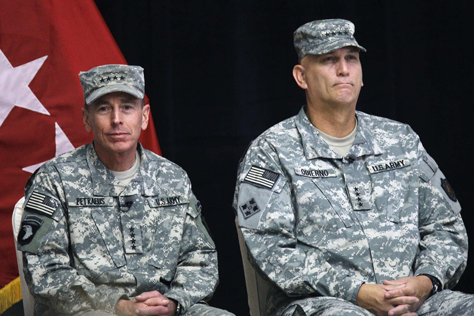 General Petraeus, left, sits beside General Raymond Odierno during a change-of-command ceremony at Camp Victory on September 16, 2008.
