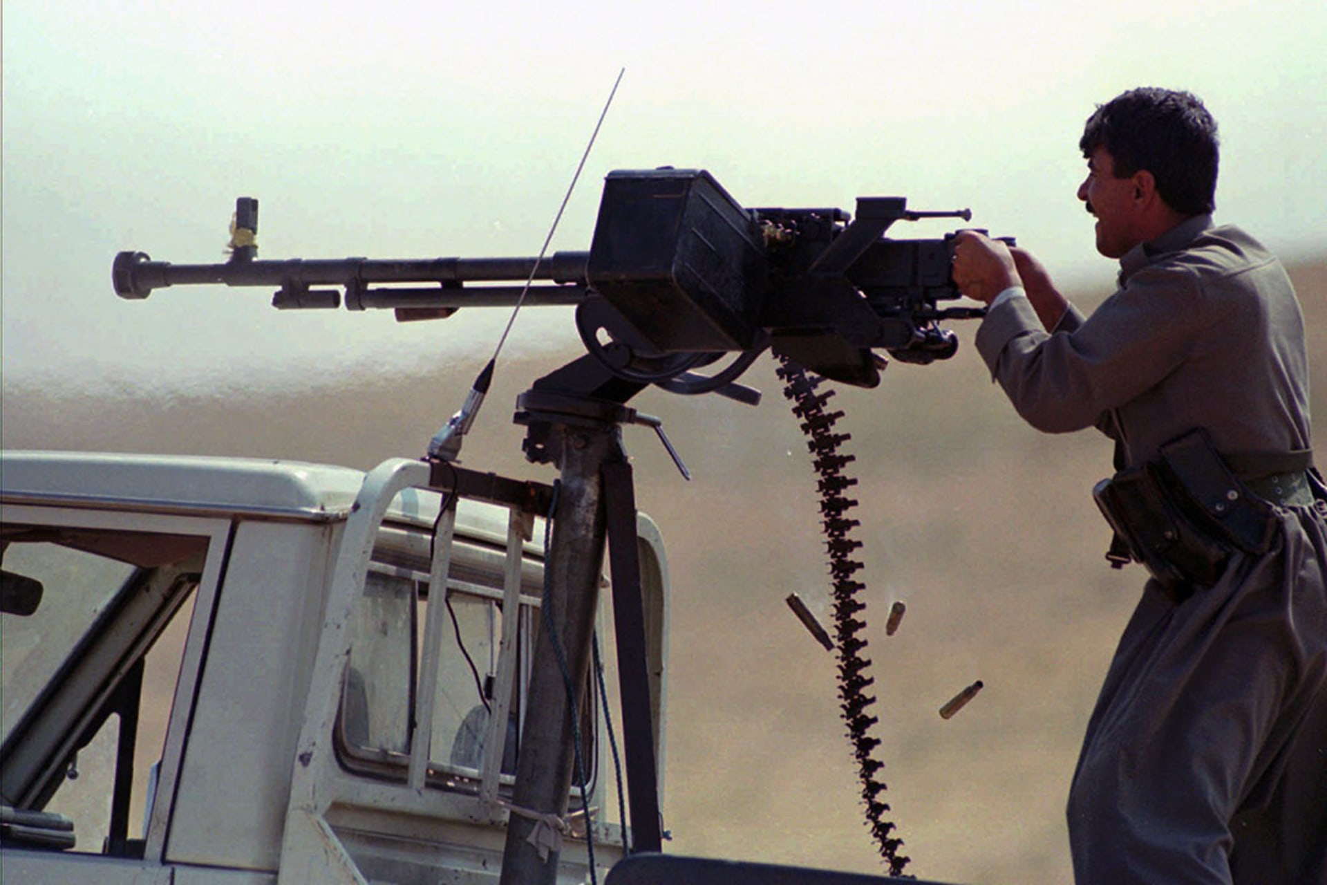 A KDP fighter fires on PUK-held positions southeast of Erbil on September 5, 1996.
