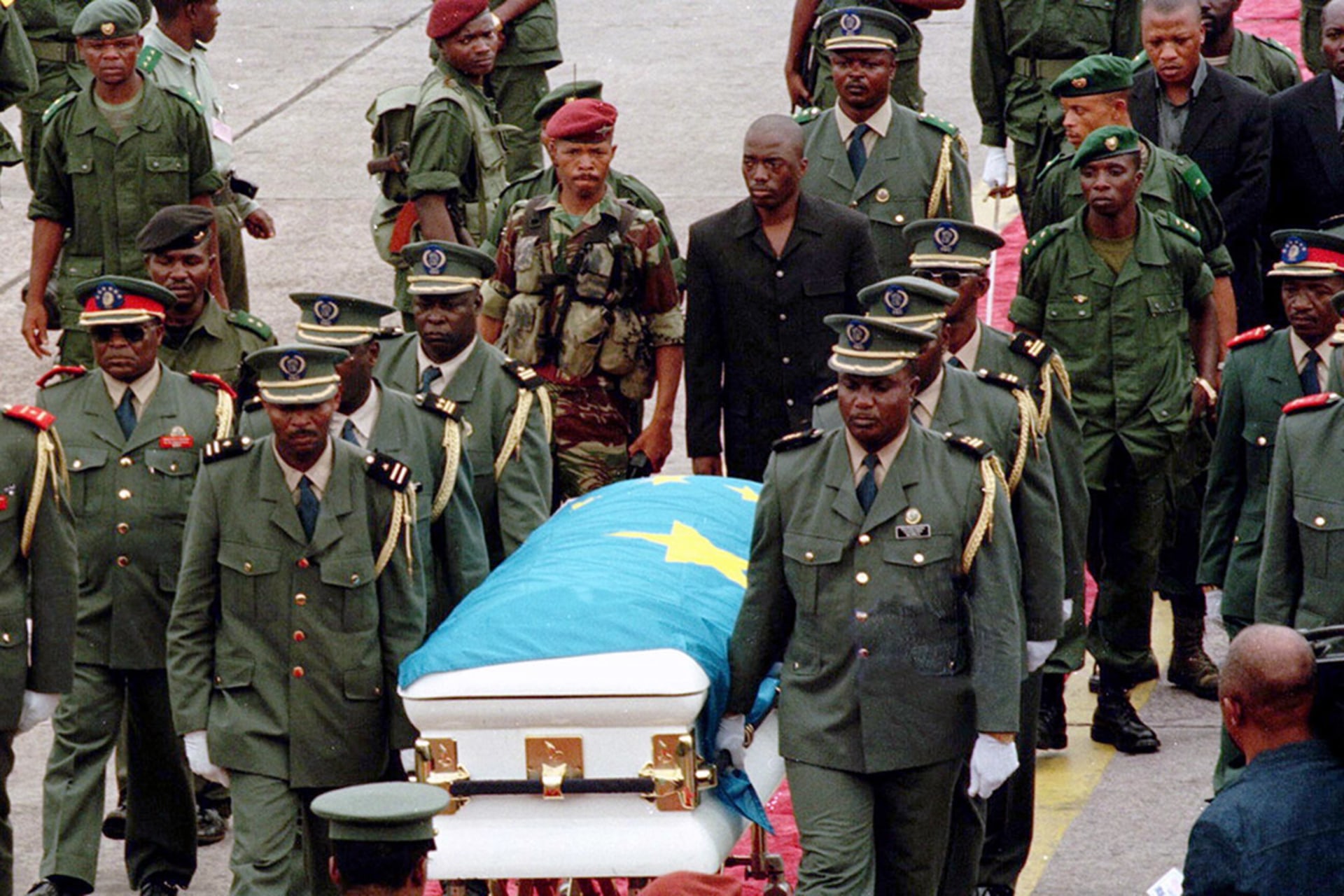 Joseph Kabila Kabange follows the coffin of his father as it is transported by military officers, on January 21, 2001. Desirey Minkoh/AFP/Getty Images