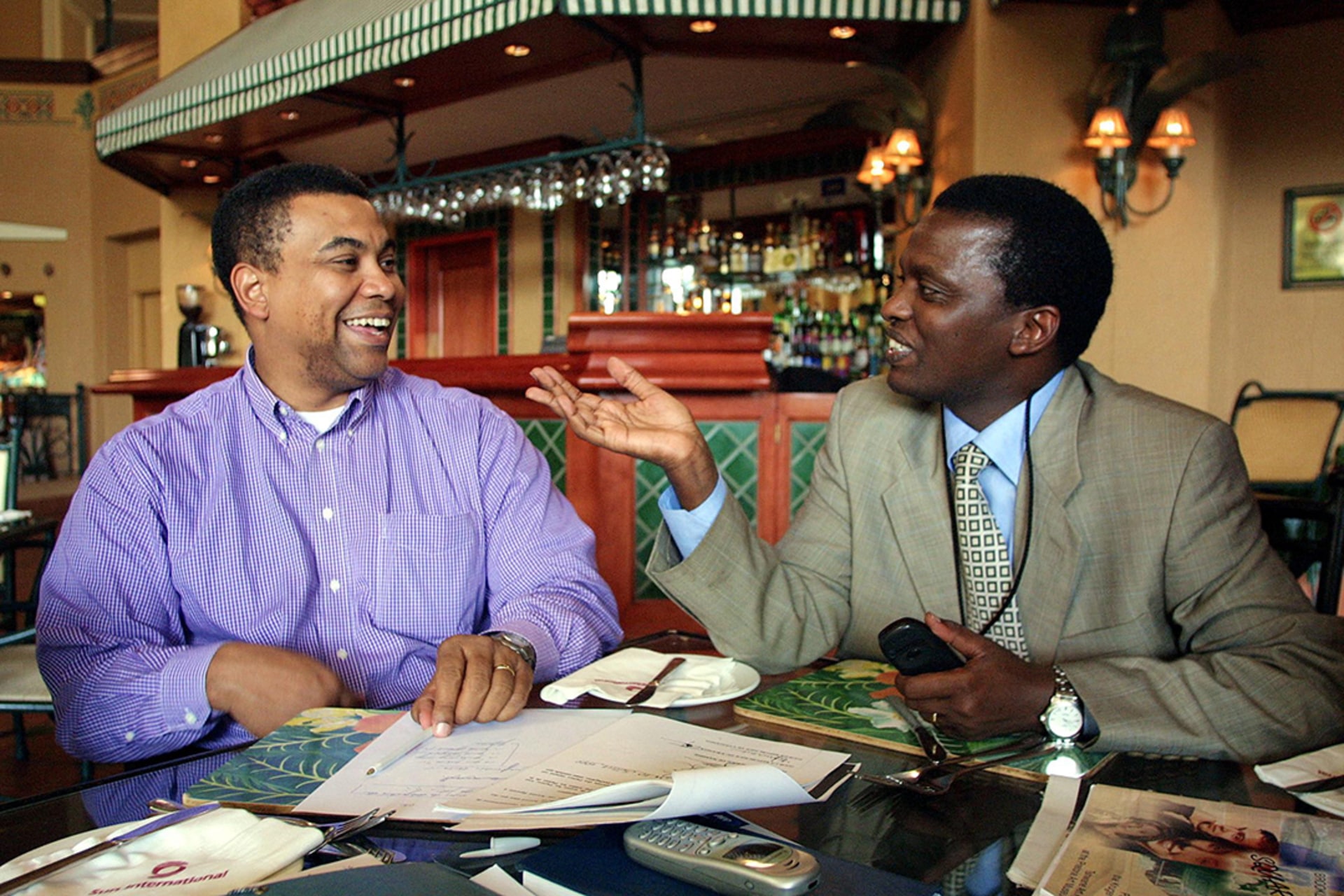 Oliver Kamitatu, Secretary-General of the Movement for the Liberation of the Congo (MLC), and Azarias Ruberwa, Secretary-General of the Congolese Rally for Democracy (RCD) meet during peace talks in 2002. Anna Zieminski/AFP/Getty Images
