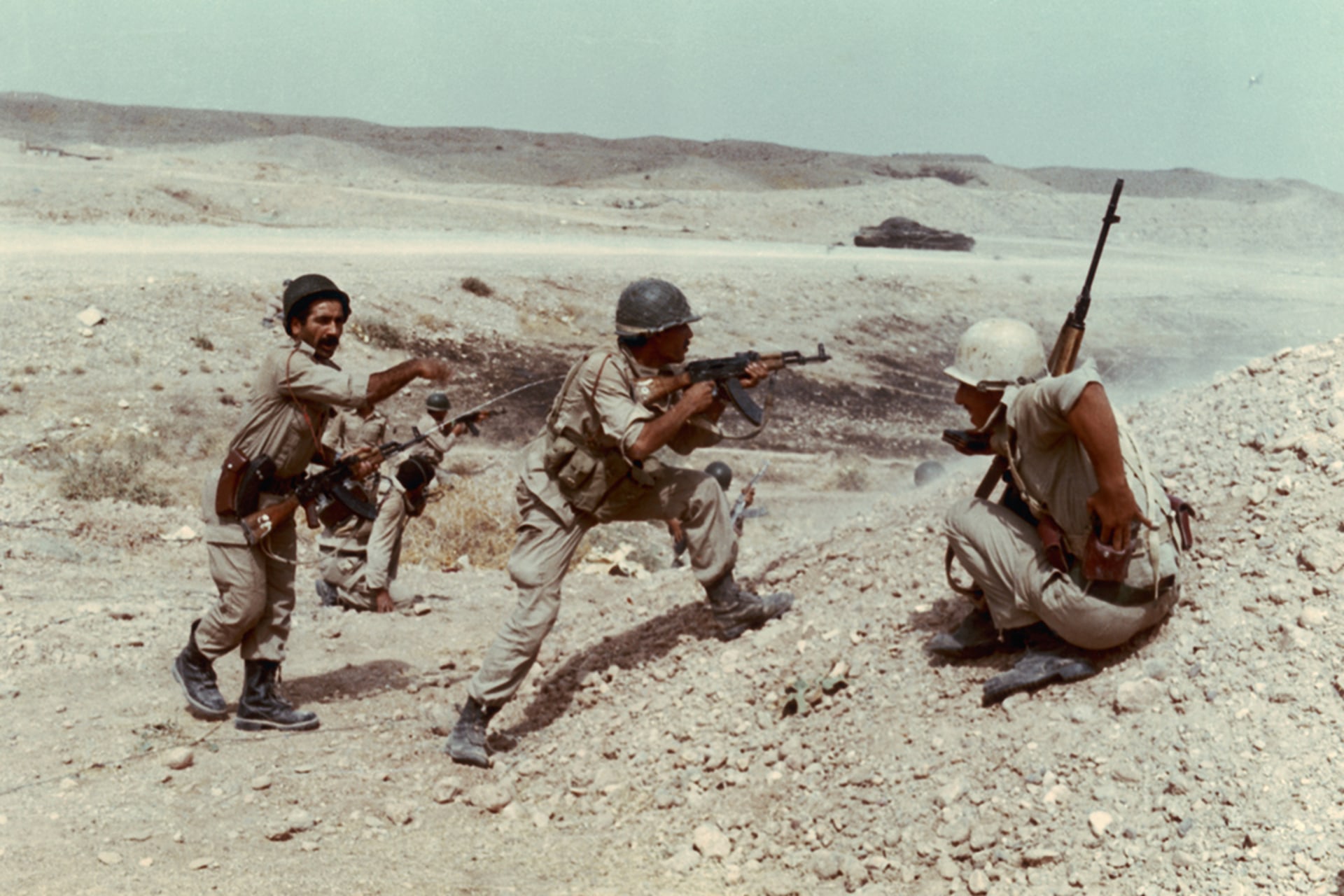 Iraqi soldiers fire at Iranian troops during the Iran-Iraq War.