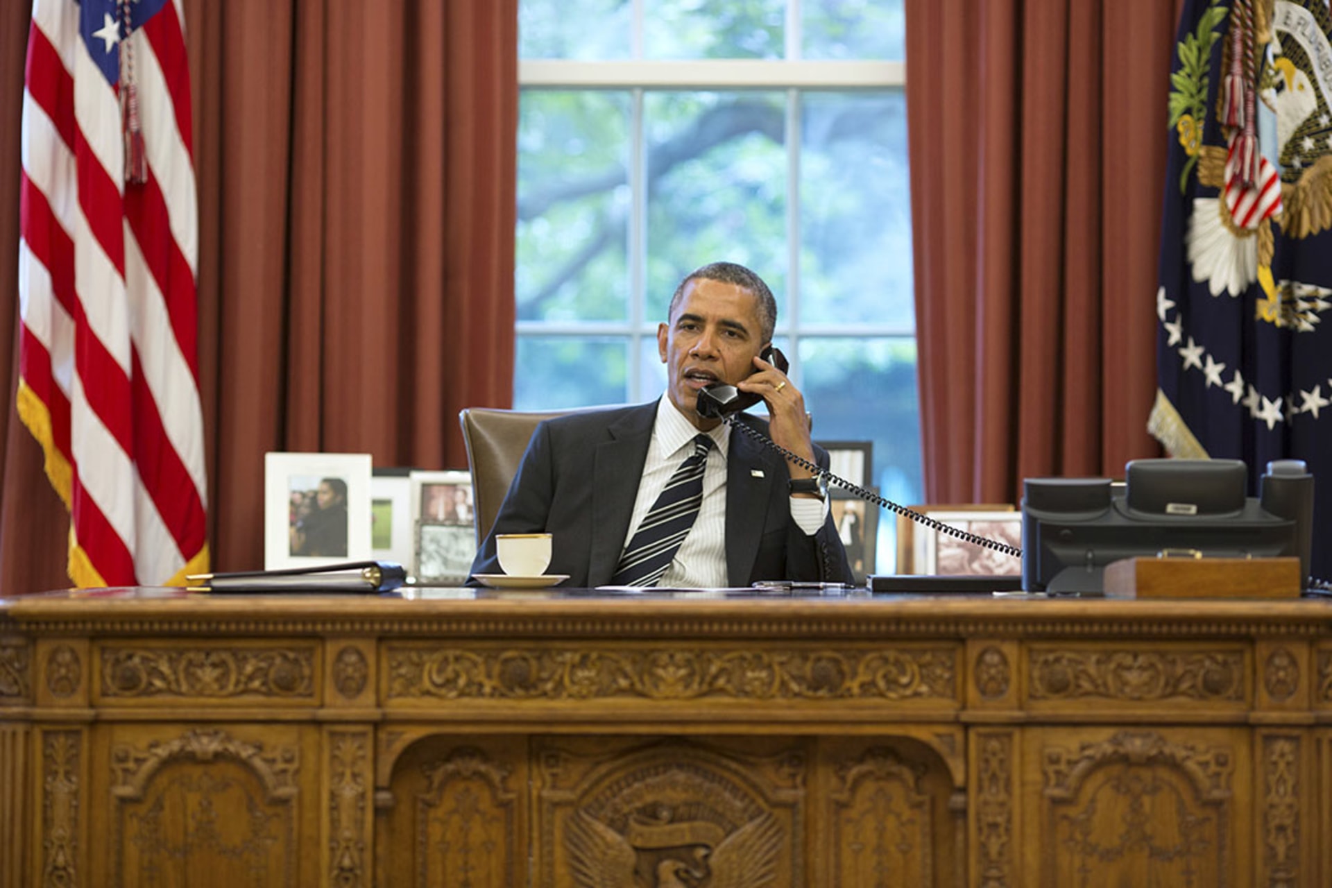 U.S. President Barack Obama talks with Iranian President Hassan Rouhani during a phone call in the Oval Office.