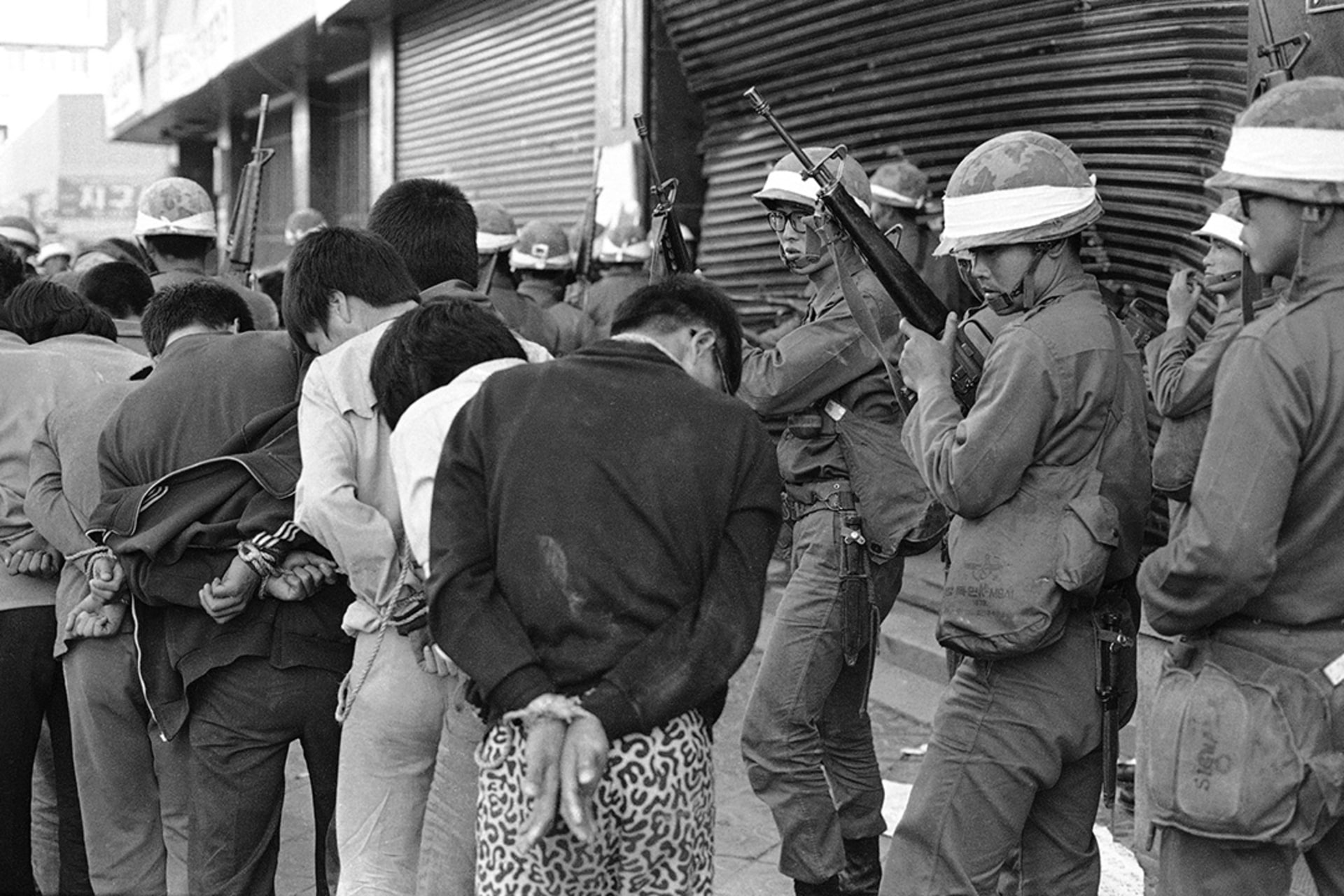 Armed South Korean soldiers capture rioters in Gwangju, South Korea, on May 27, 1980. Sadayuki Mikami/AP Photo