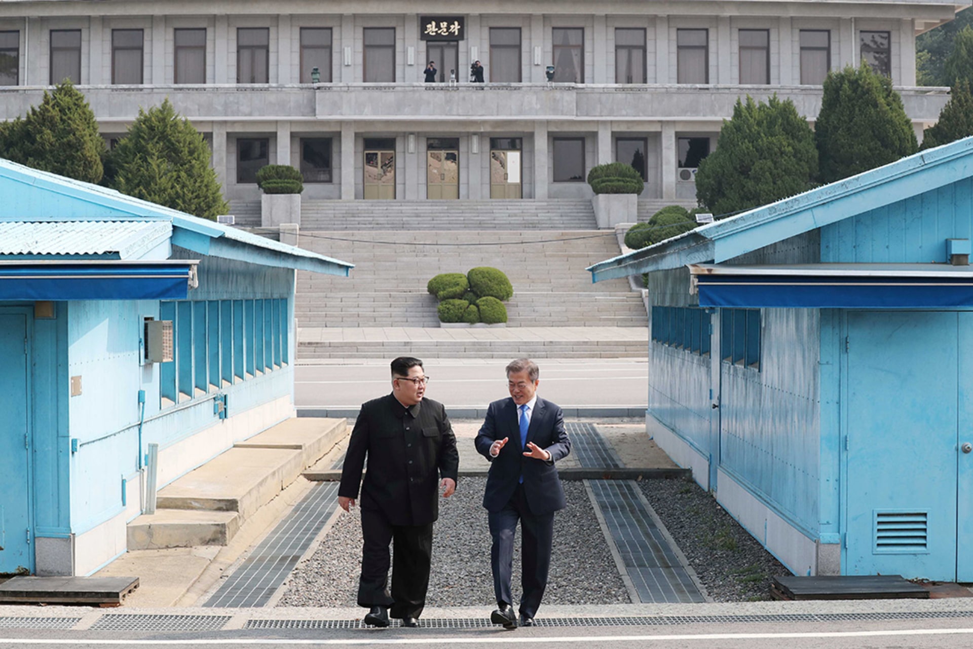 South Korean President Moon Jae-in and North Korean leader Kim Jong Un walk along the demilitarized zone in Panmunjom, South Korea. Korea Summit Press/Pool/Reuters