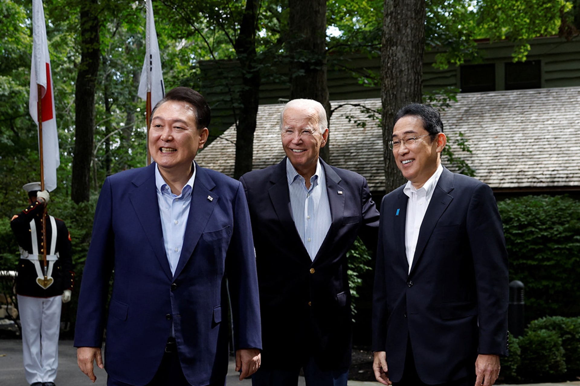 U.S. President Joe Biden, Japanese Prime Minister Fumio Kishida, and South Korean President Yoon Suk Yeol pose at Camp David near Washington, DC. Evelyn Hockstein/Reuters