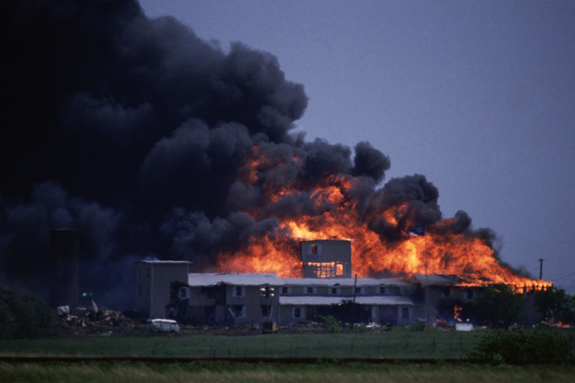 The Branch Davidians’ compound burns to the ground outside of Waco, Texas, during a raid by federal agents.
