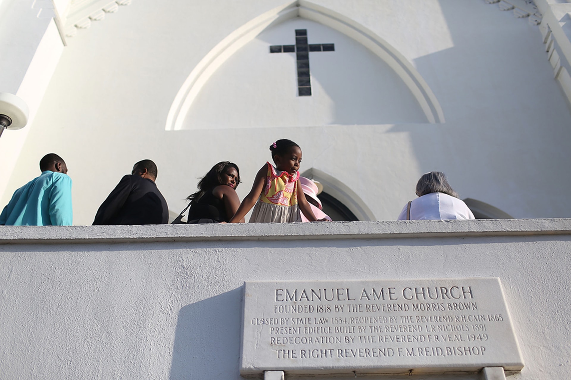 People line up to attend Sunday services following a mass shooting at Emanuel African Methodist Episcopal Church in Charleston, South Carolina. 
