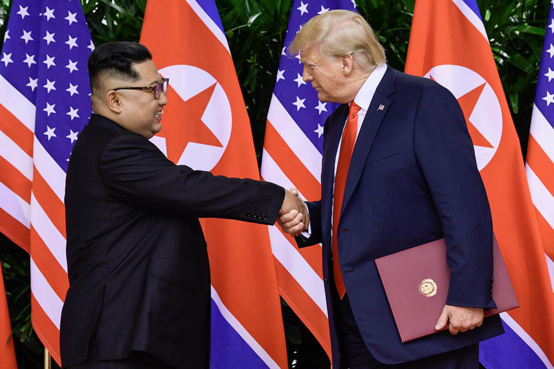 Kim and Trump shake hands after their summit. Susan Walsh/Pool/Reuters