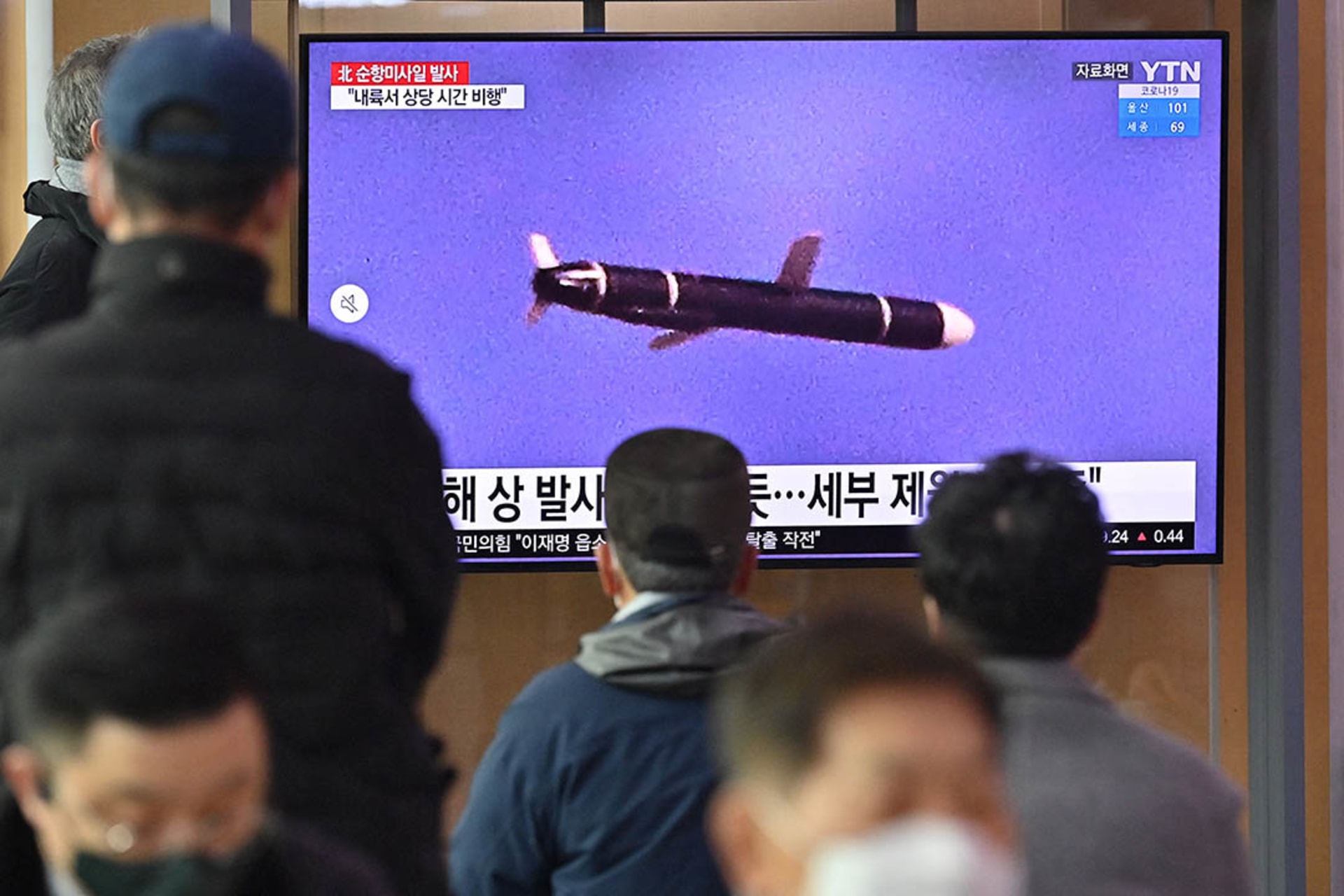 People watch a news broadcast showing file footage of a North Korean missile test in January 2022. Jung Yeon-je/AFP/Getty Images