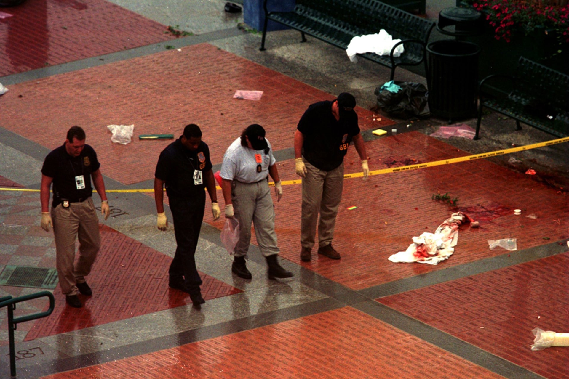 Law enforcement officers investigate the bombing at Centennial Olympic Park in Atlanta. Barry Chin/Boston Globe/Getty Images