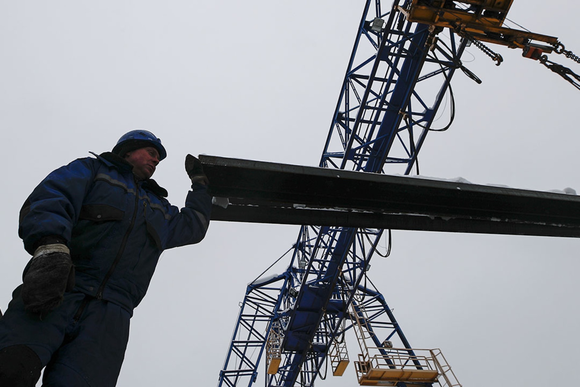A worker takes control of the loading of steel channels at the Ariel Metal steel trader warehouse in Podolsk outside Moscow, Russia. Maxim Shemetov/Reuters