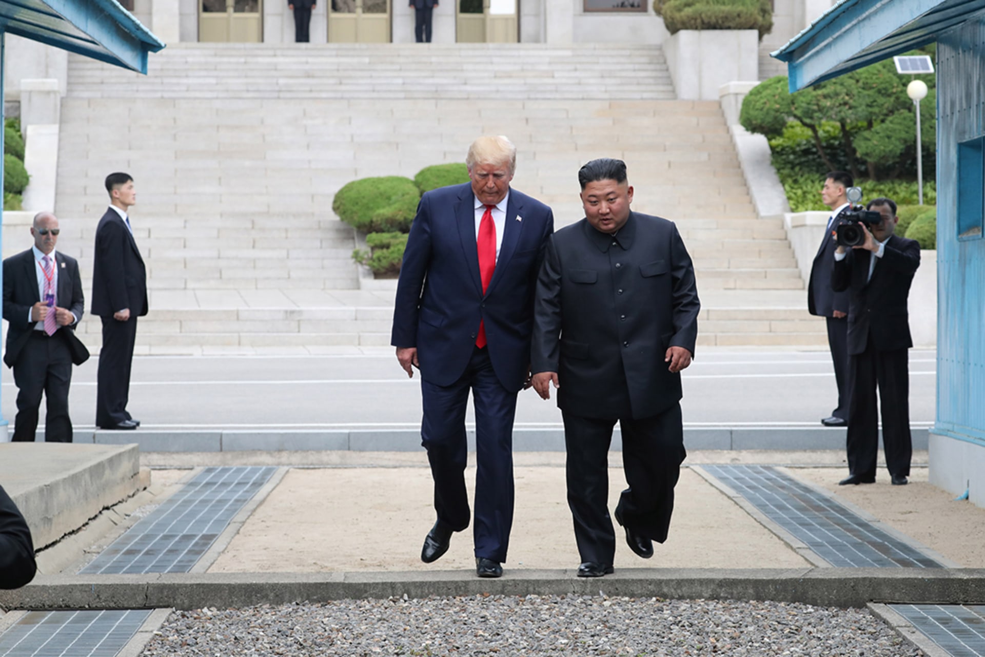 Trump and Kim step across the border between North and South Korea. Dong-A Ilbo/Getty Images