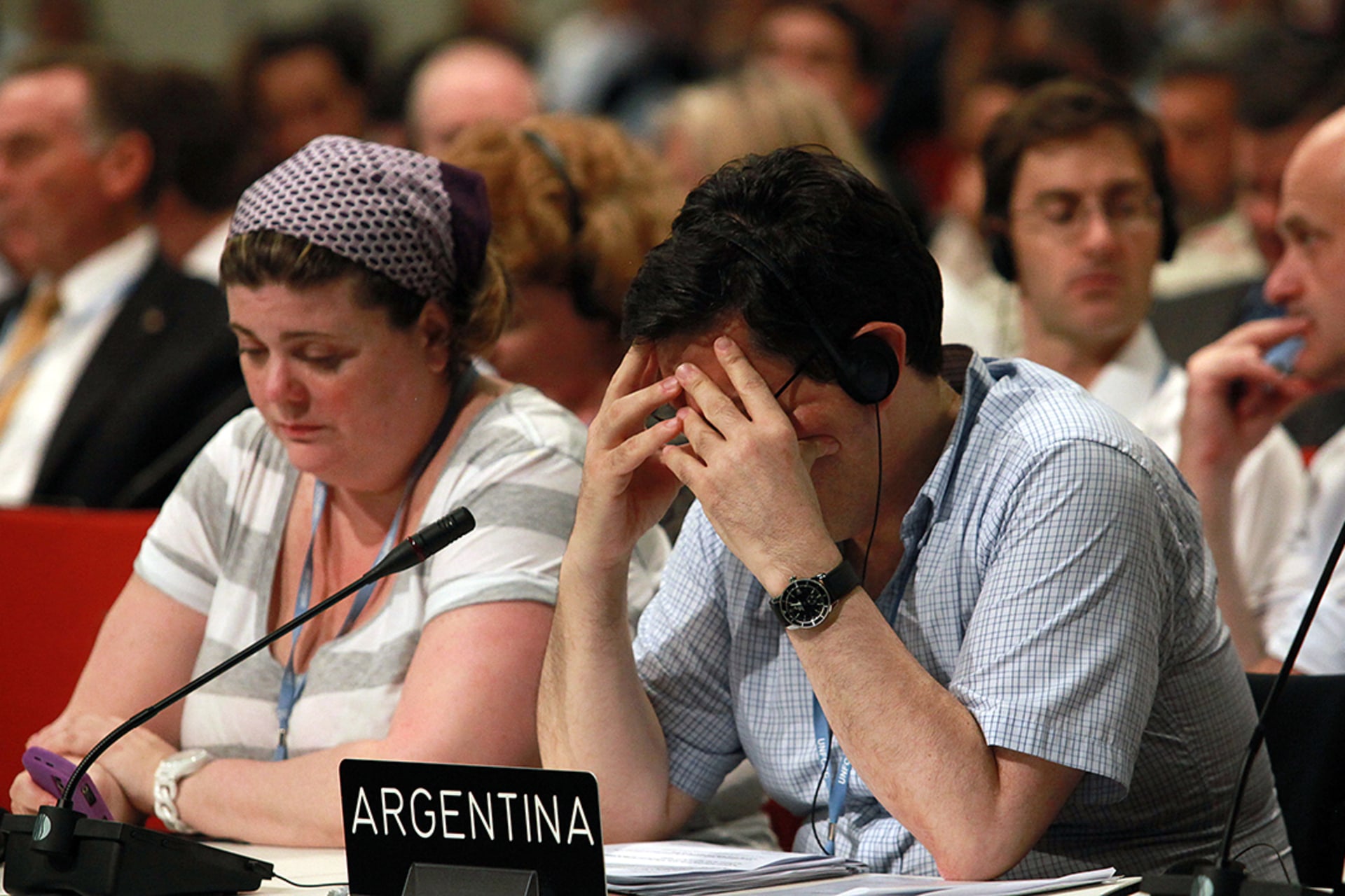 Delegates reach a deal in the early hours of the morning on the conference’s last day. Rajesh Jantilal/AFP/Getty Images