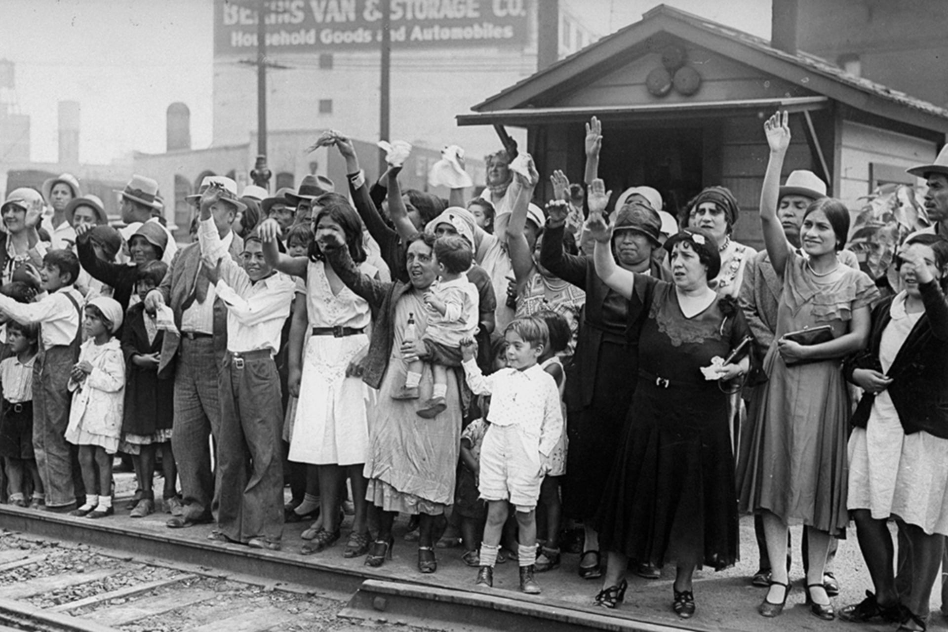 Friends and family wave goodbye to Mexicans who are being expelled back to Mexico as the United States begins a national repatriation program. New York Daily News Archive/Getty Images