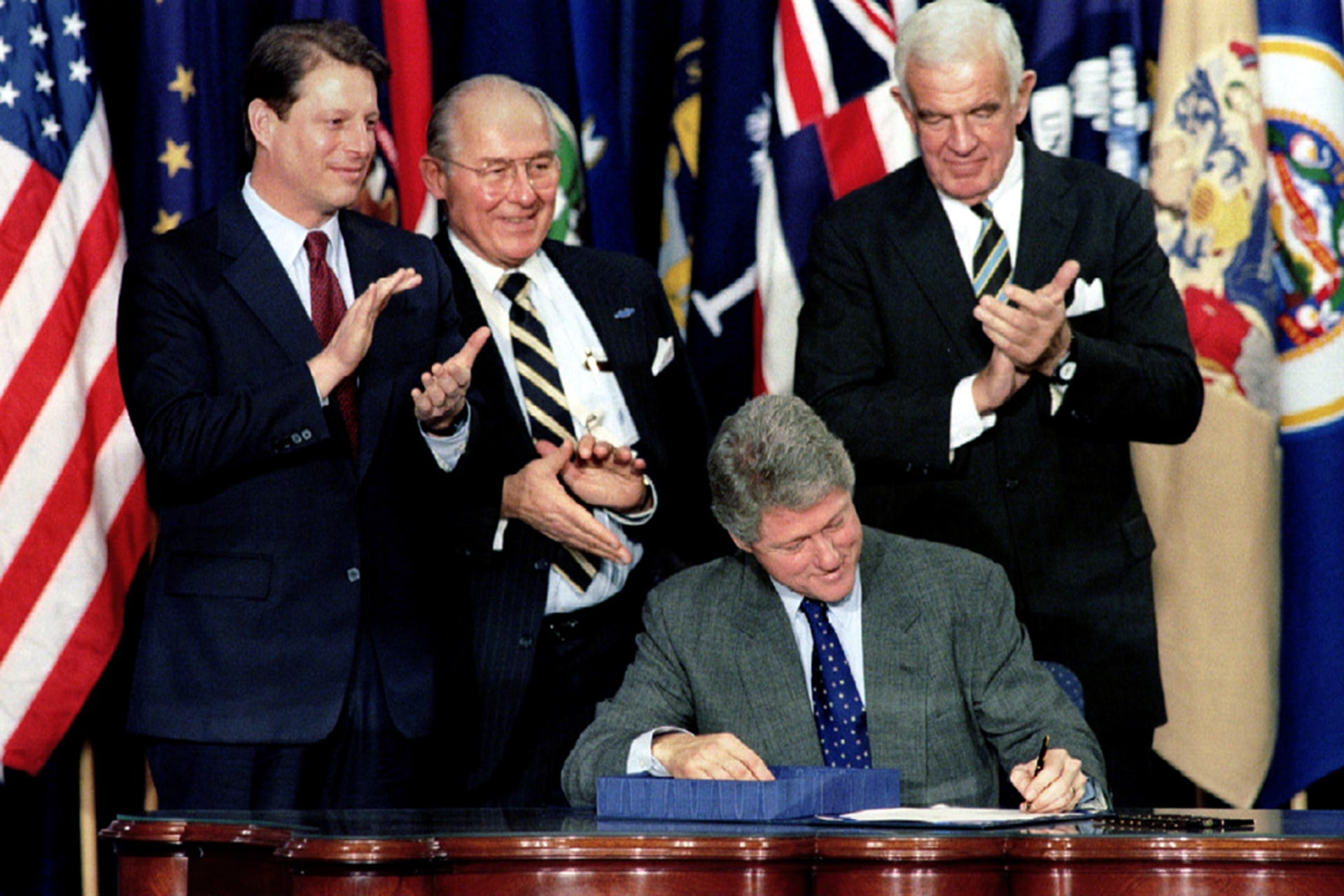 U.S. President Bill Clinton signs the North American Free Trade Agreement (NAFTA) into law on December 8, 1993. Mike Theiler/Reuters