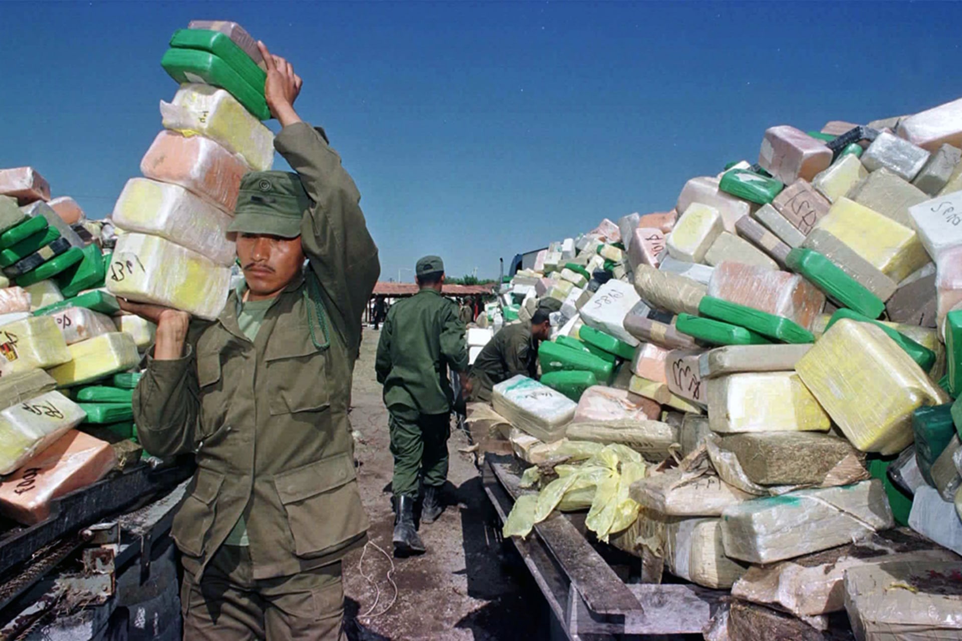 A Mexican soldier carries blocks of cocaine seized in drug raids to an incinerator in Tamaulipas, Mexico. Gerado Magallon/Reuters