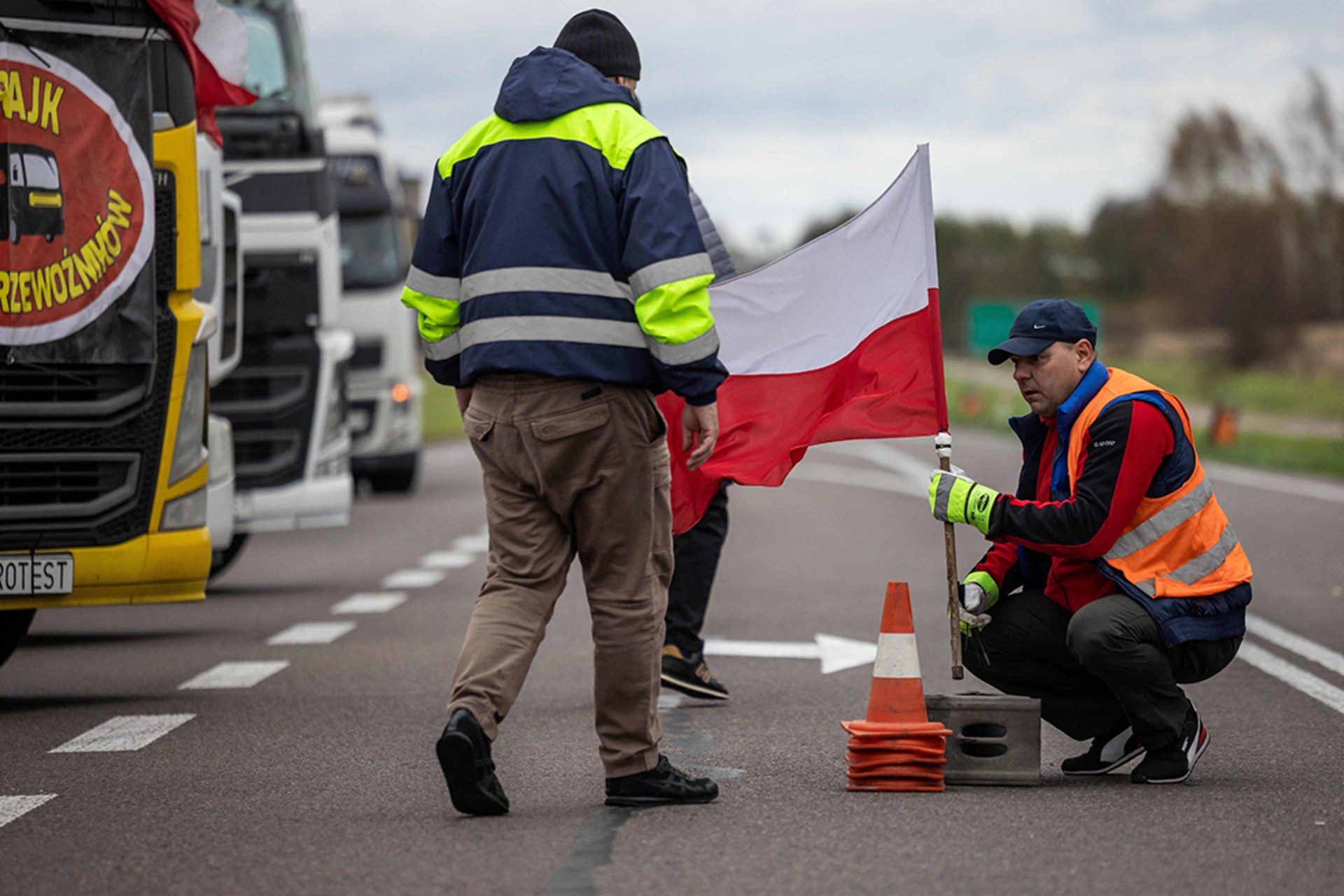 Polish demonstrators block access to a major border crossing between Poland and Ukraine in protest of unfair competition over grain. 
