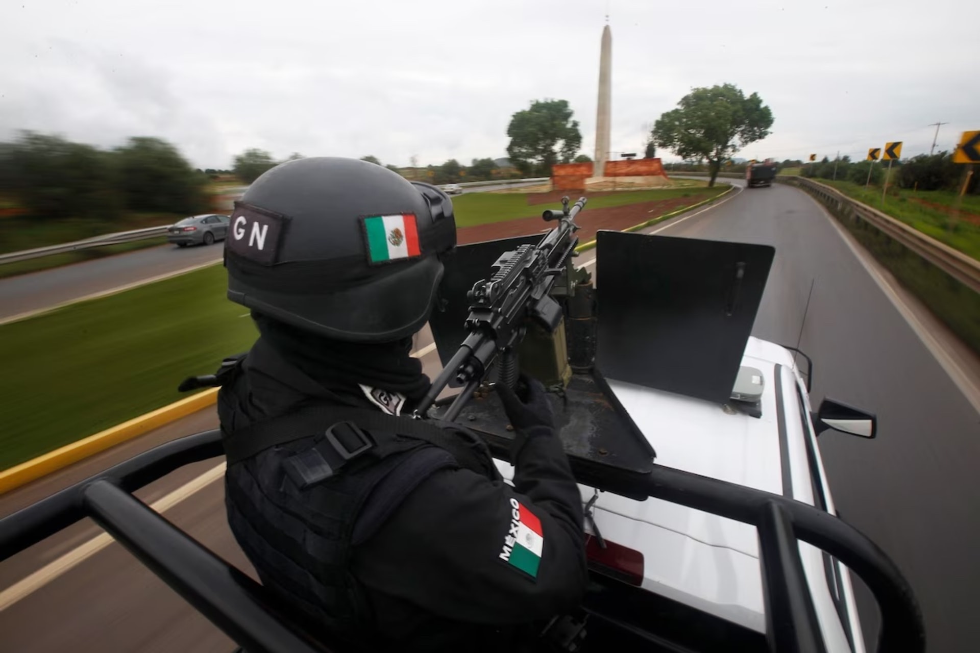 <p>Members of Mexico’s National Guard patrol a highway in July 2021 after clashes between drug cartels. </p>
