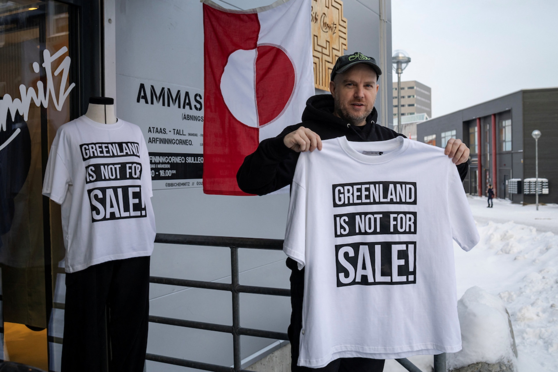 <p>A shop owner David Rogilds holds a shirt that he sells in Nuuk, Greenland, January 14, 2026.</p>
