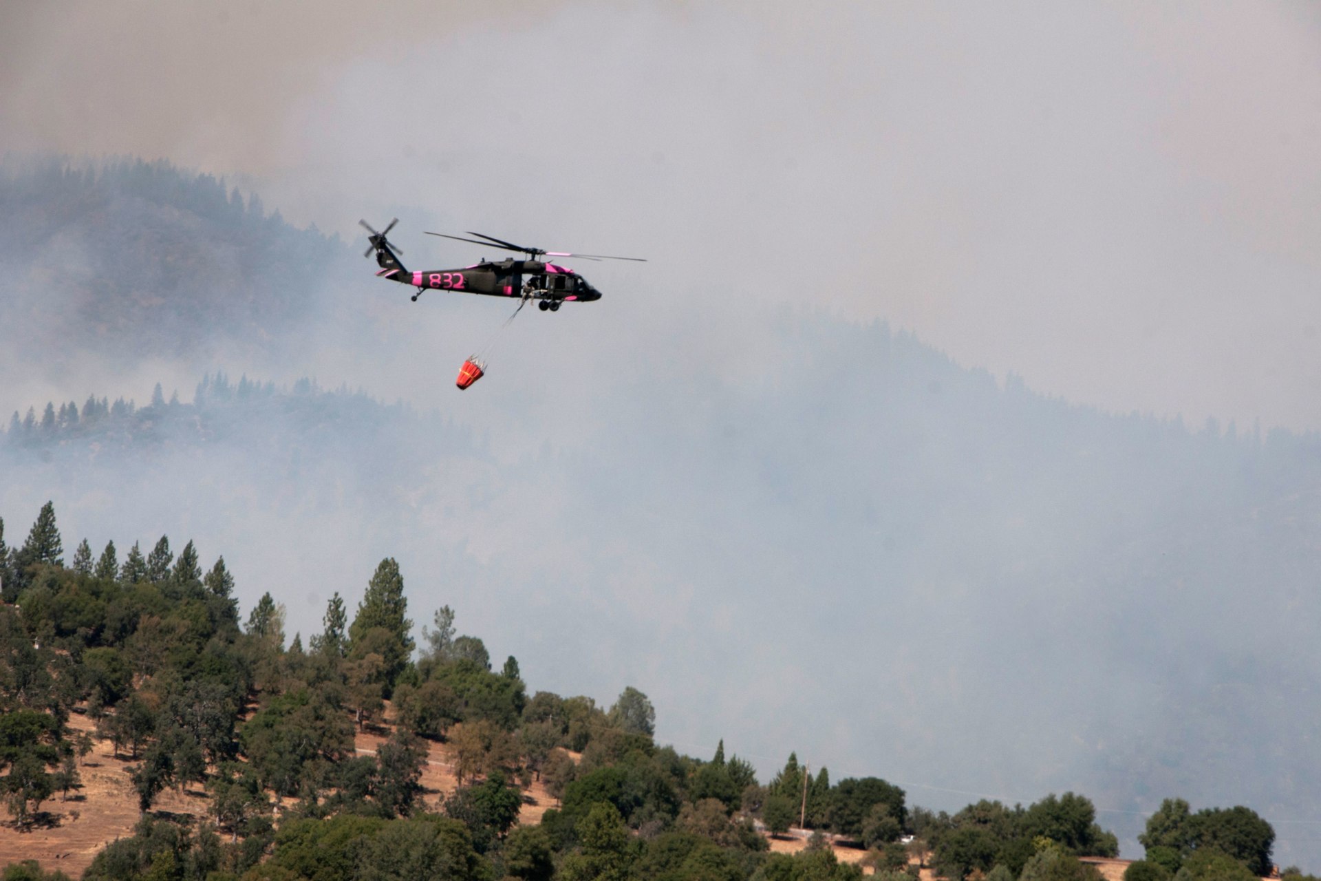 <p>California Army National Guard UH-60 Black Hawk helicopter assists in fighting a massive wildfire near Yosemite National Park.</p>

