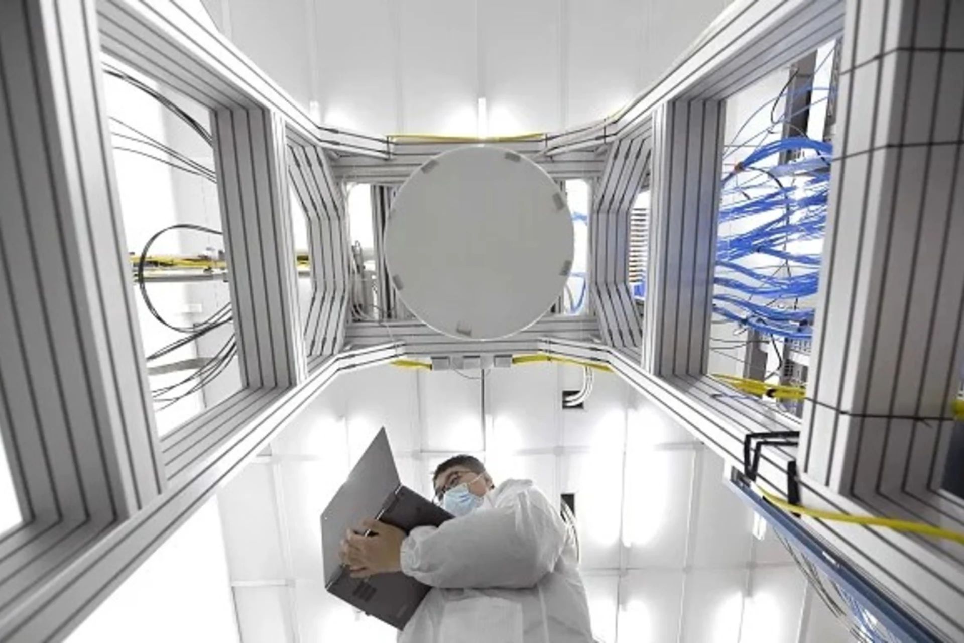 <p>A researcher works inside a superconducting quantum computing laboratory at Beijing Academy of Quantum Information Sciences in February 2021 in Beijing, China.</p>