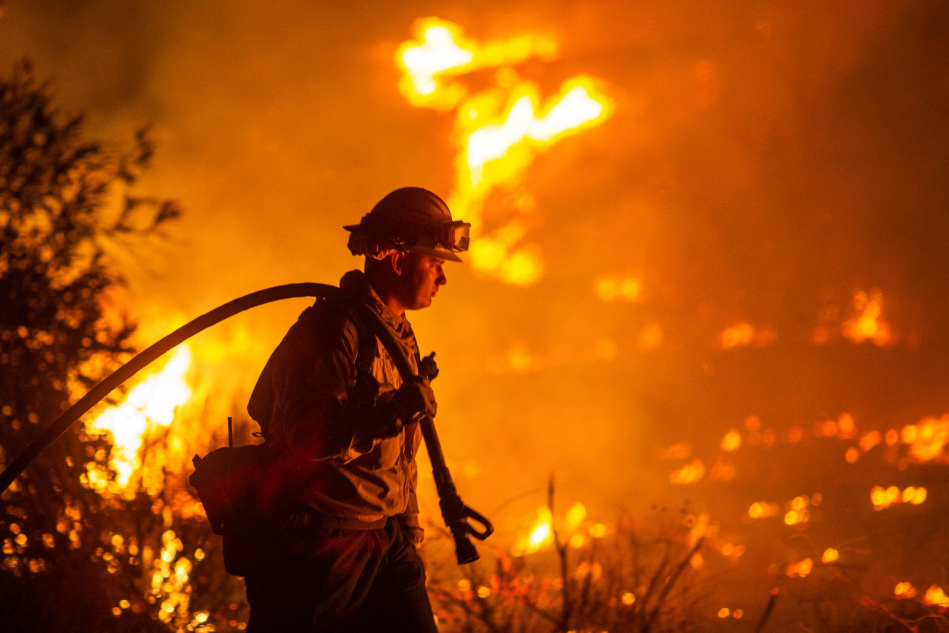 Firefighters and aircraft battle the Hughes Fire near Santa Clarita