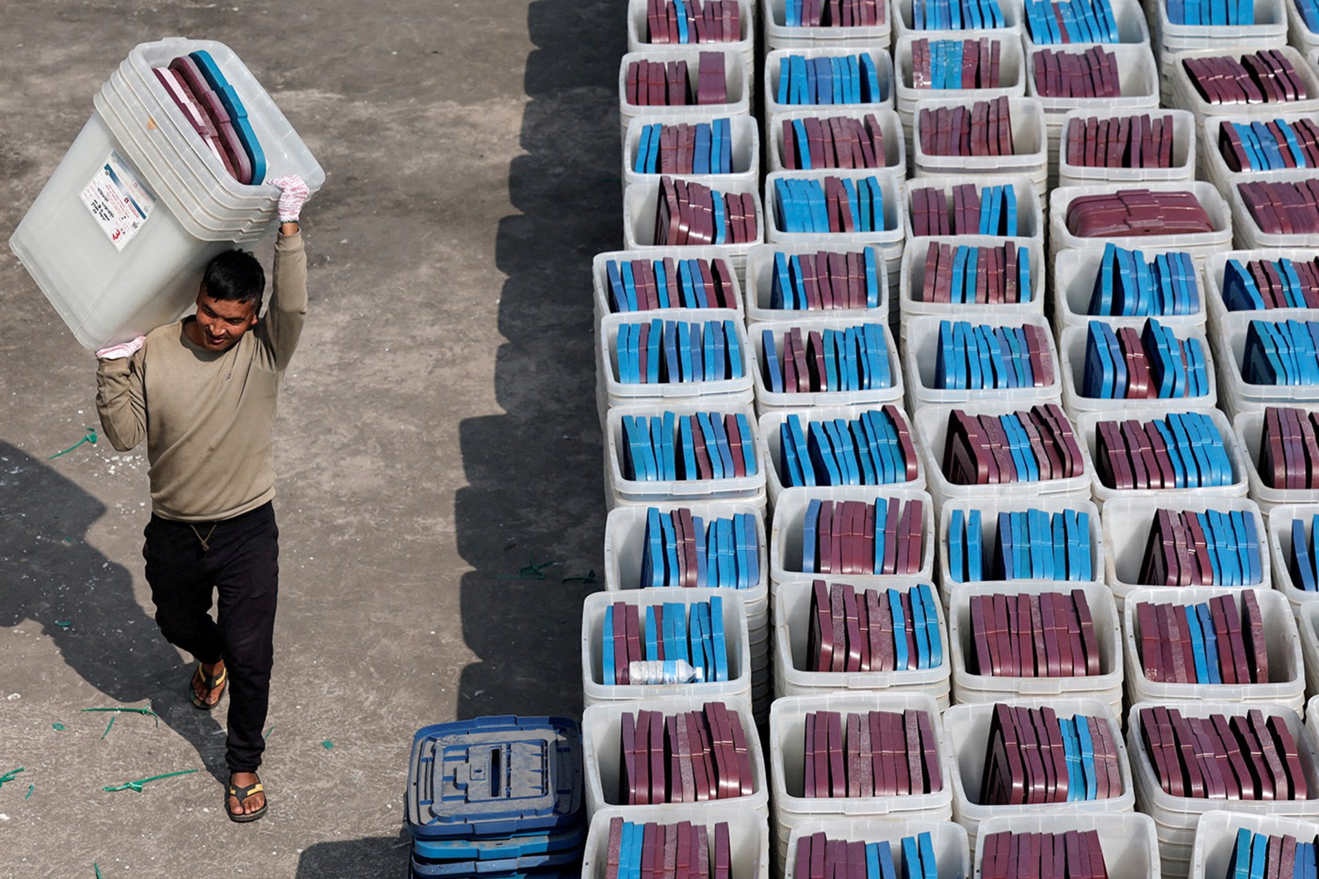 Security personnel carry ballot boxes in Kathmandu.