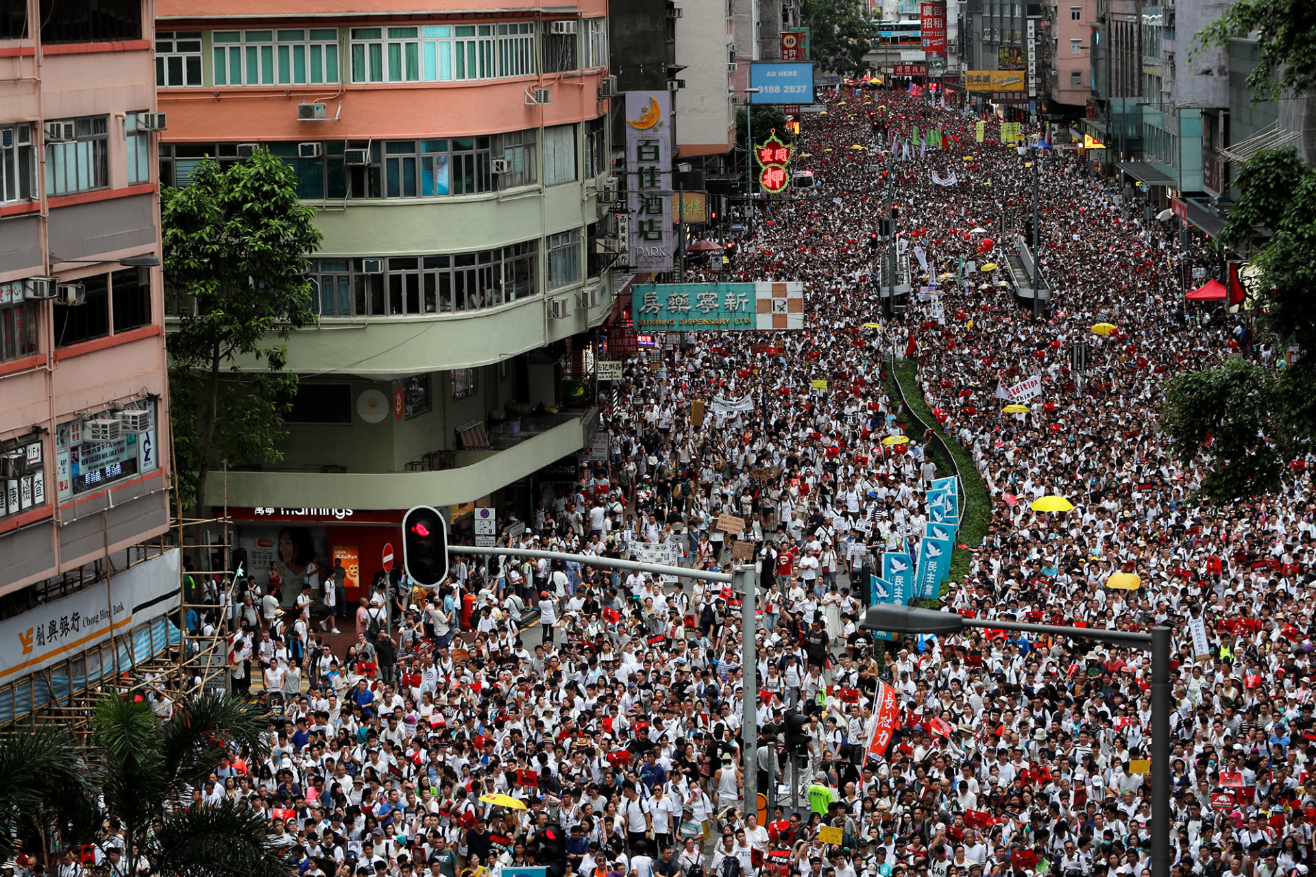 Image of mass demonstrations flooding streets in Hong Kong.