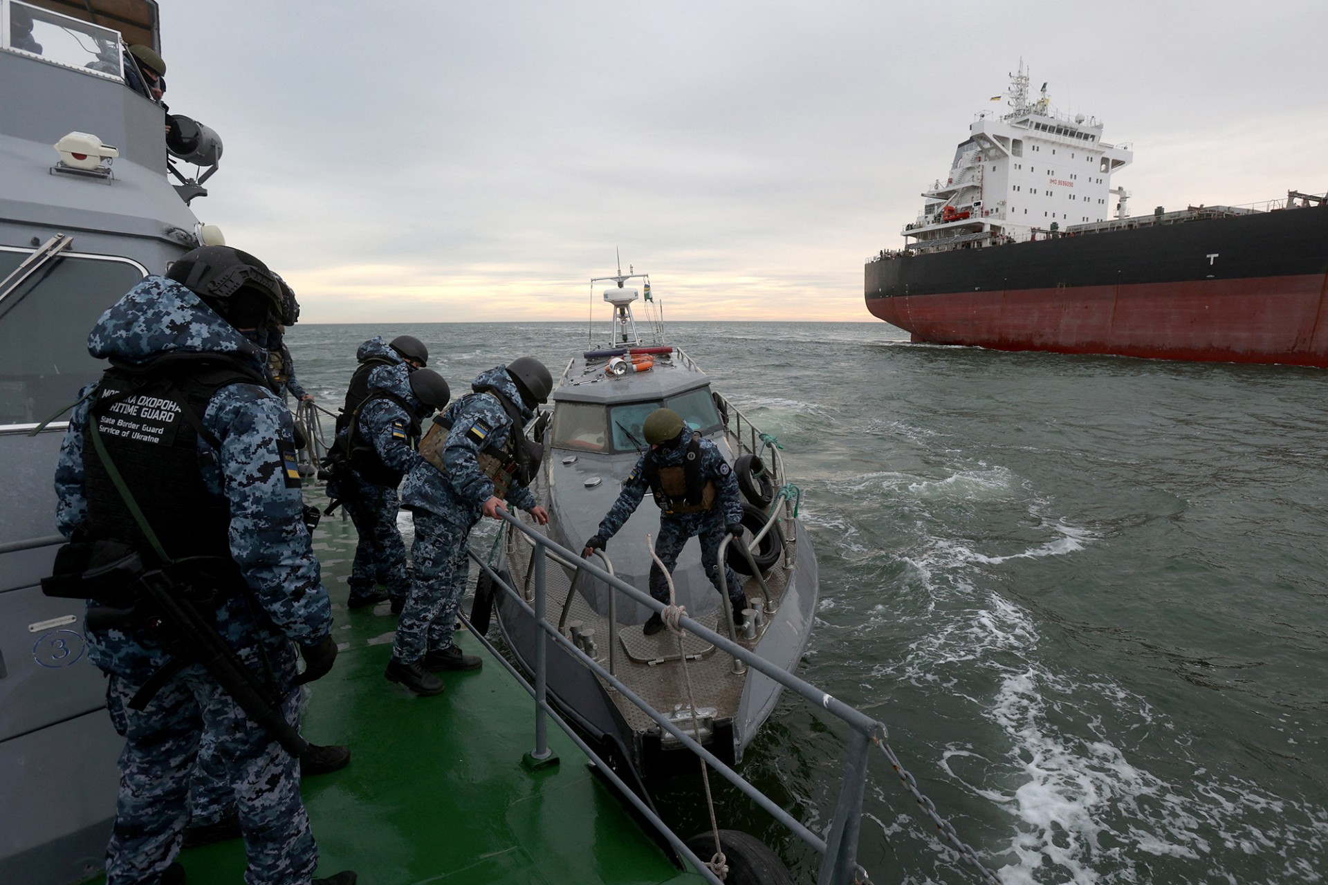 <p>BLACK SEA: A Ukrainian crew prepares to inspect an inbound cargo ship in December 2023. <span class="immersive-image__figcaption-credit">Anatolii Stepanov/AFP/Getty Images</span></p>
