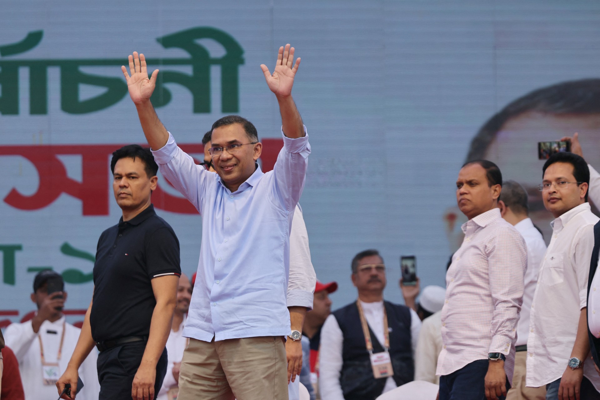 Bangladesh Nationalist Party chairman Tarique Rahman gestures to crowd during an election campaign rally.